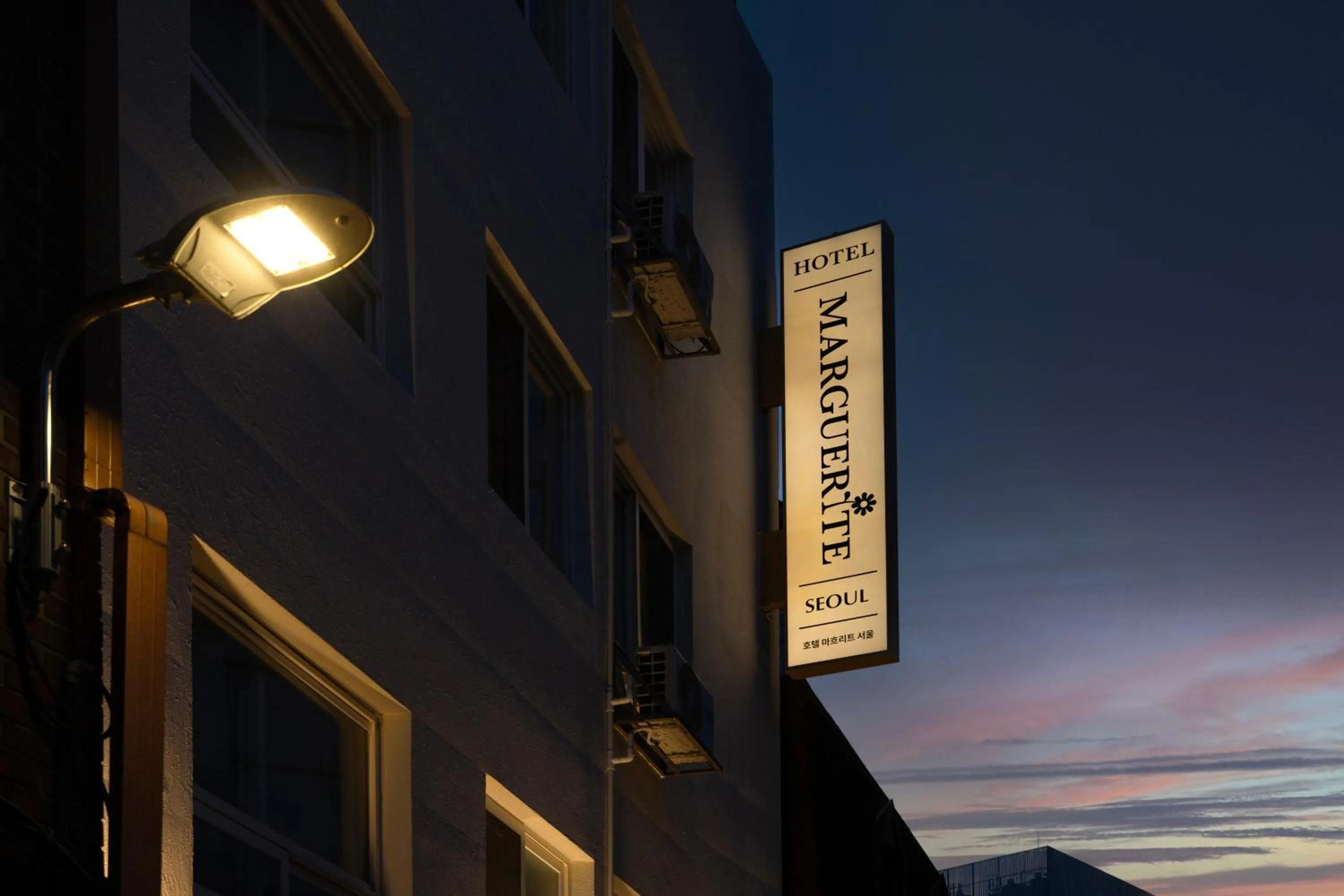 Property logo or sign in Myeongdong Guesthouse Como