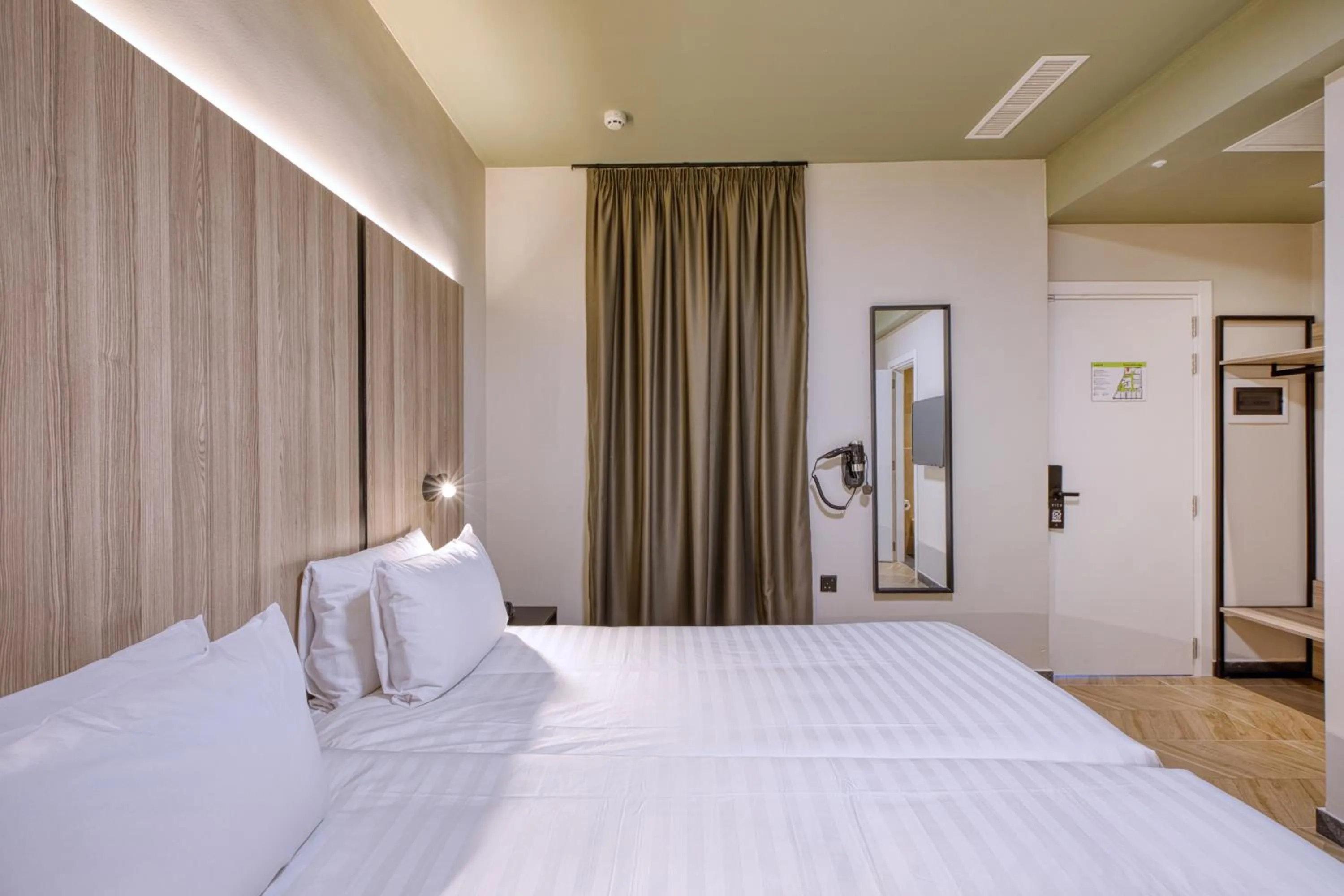 Bed in VITA Hotel & Rooftop