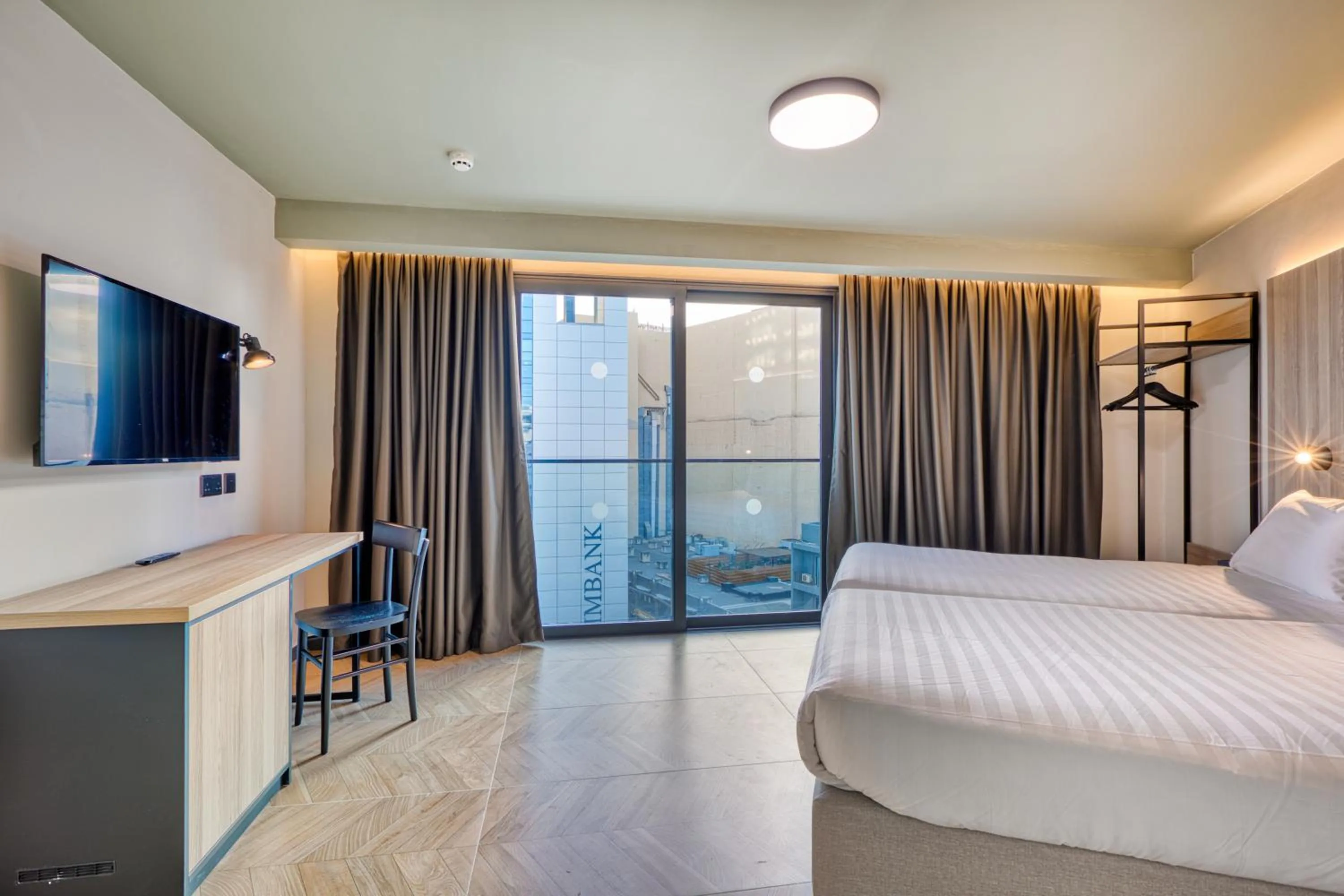 Bed in VITA Hotel & Rooftop