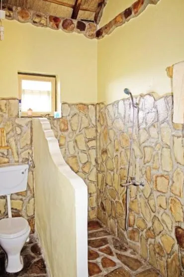 Shower in Nyore Hillside Retreat