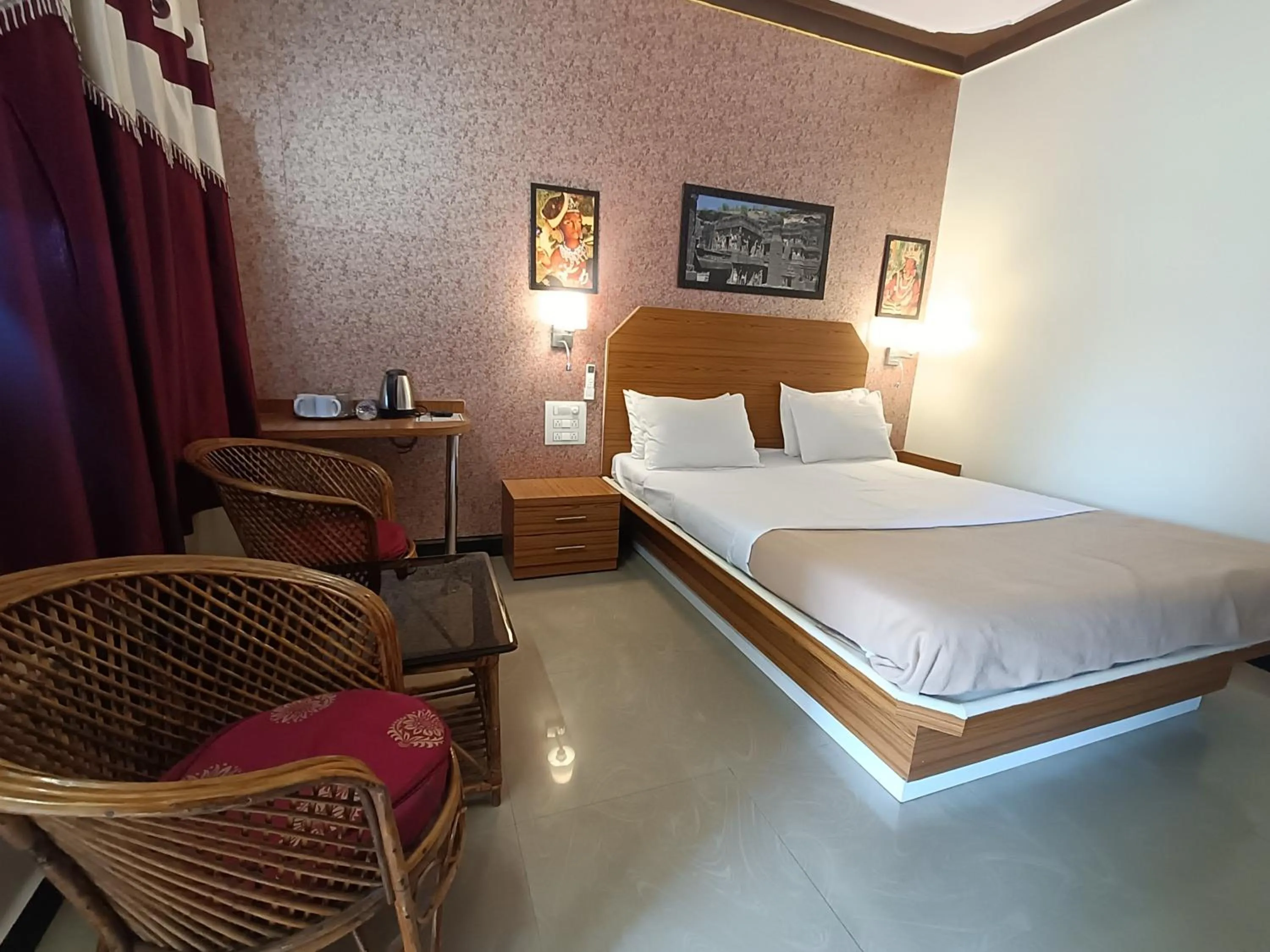 Bed in Ellora Heritage Resort