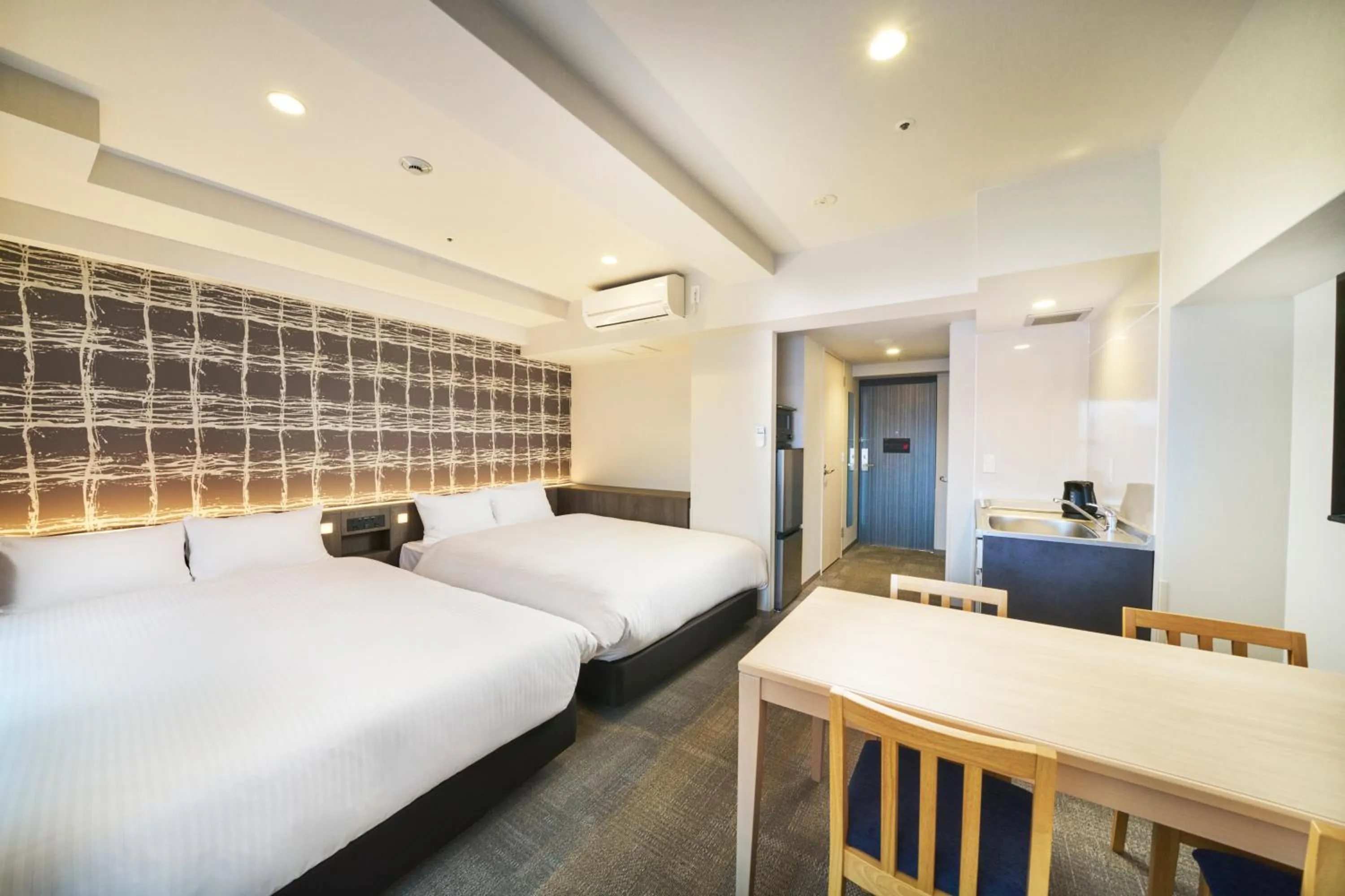 Photo of the whole room, Bed in KOKO HOTEL Osaka Namba Sennichimae