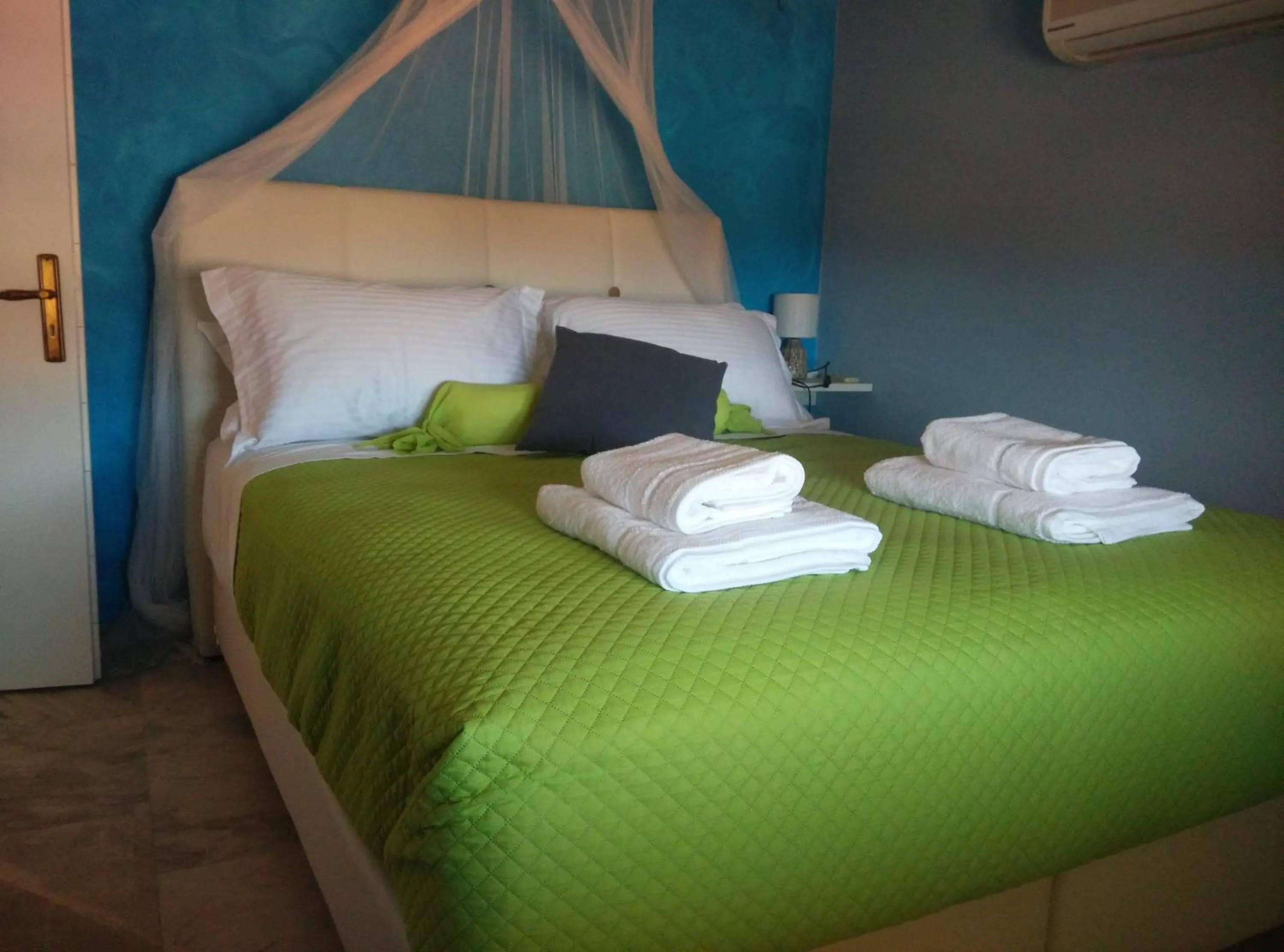 Bed in Poseidon Apartments