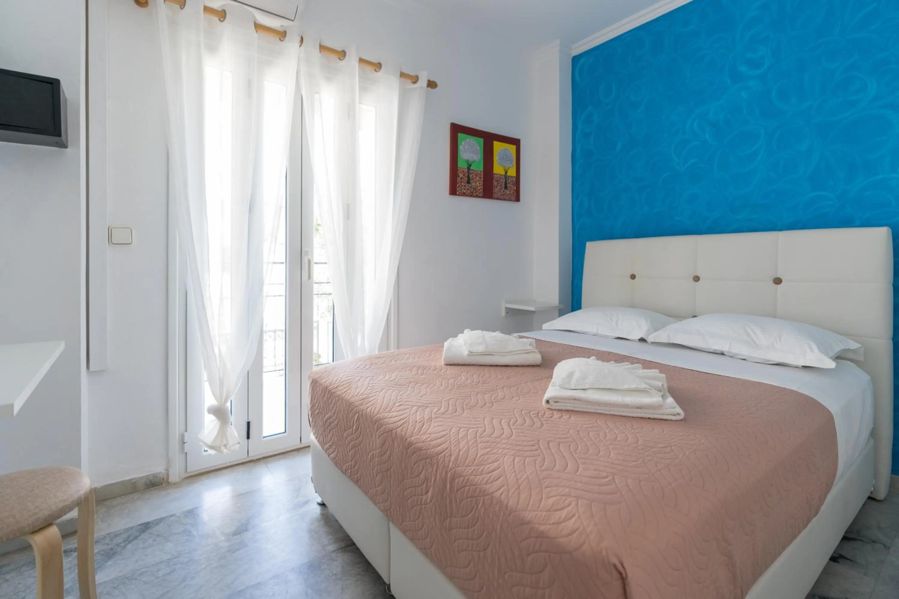 Bed in Poseidon Apartments