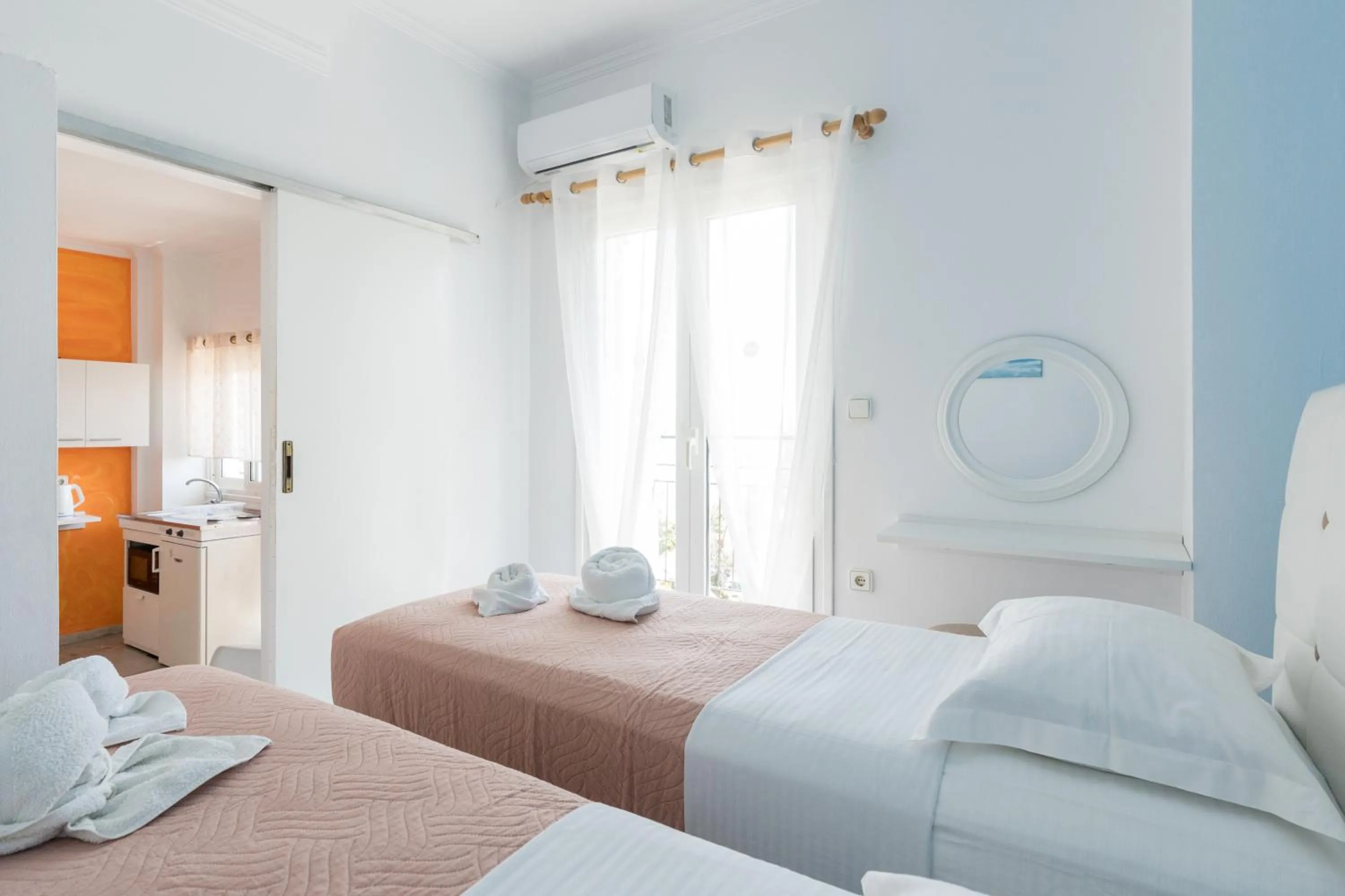 Bed in Poseidon Apartments