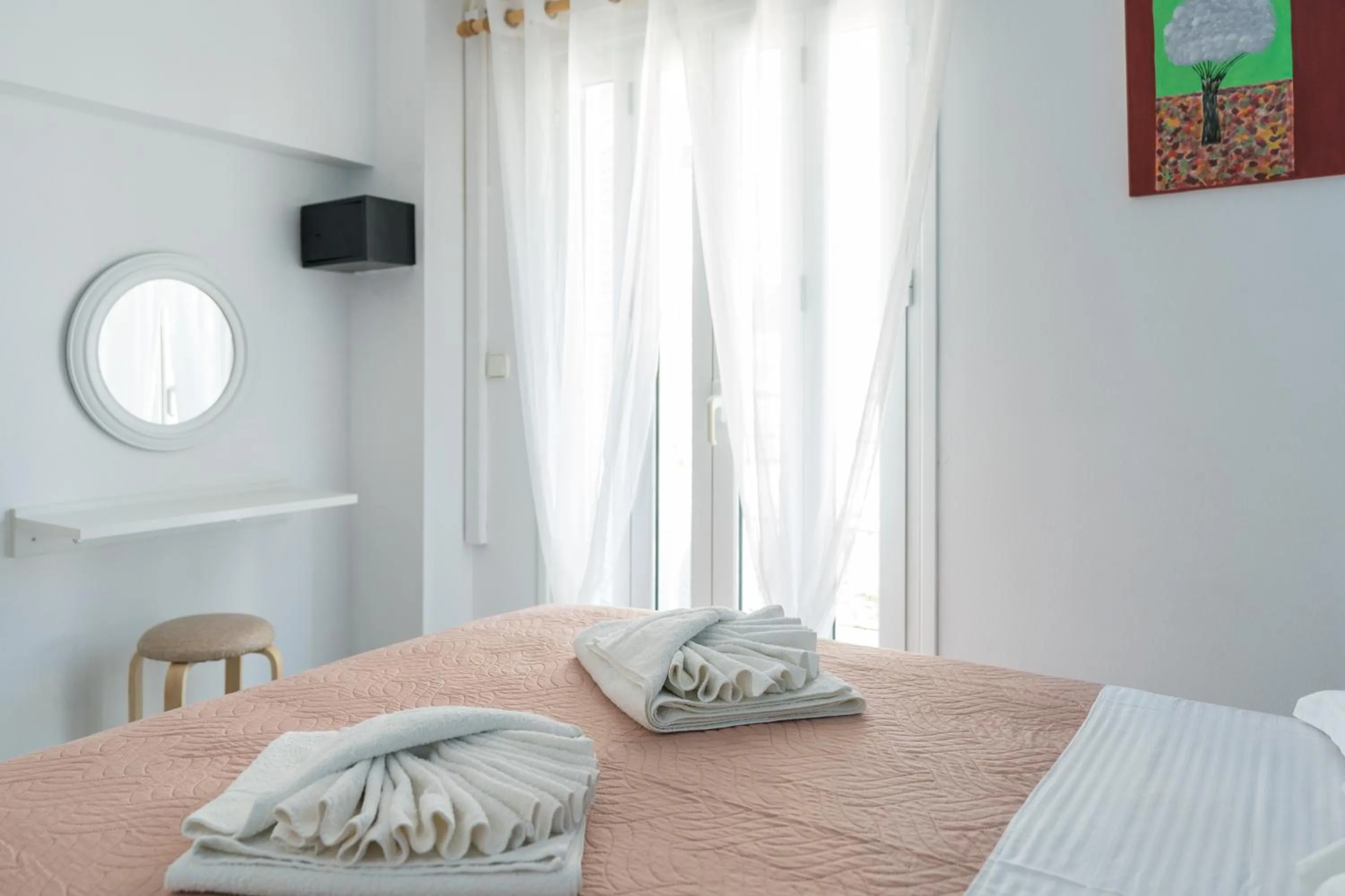 Bed in Poseidon Apartments