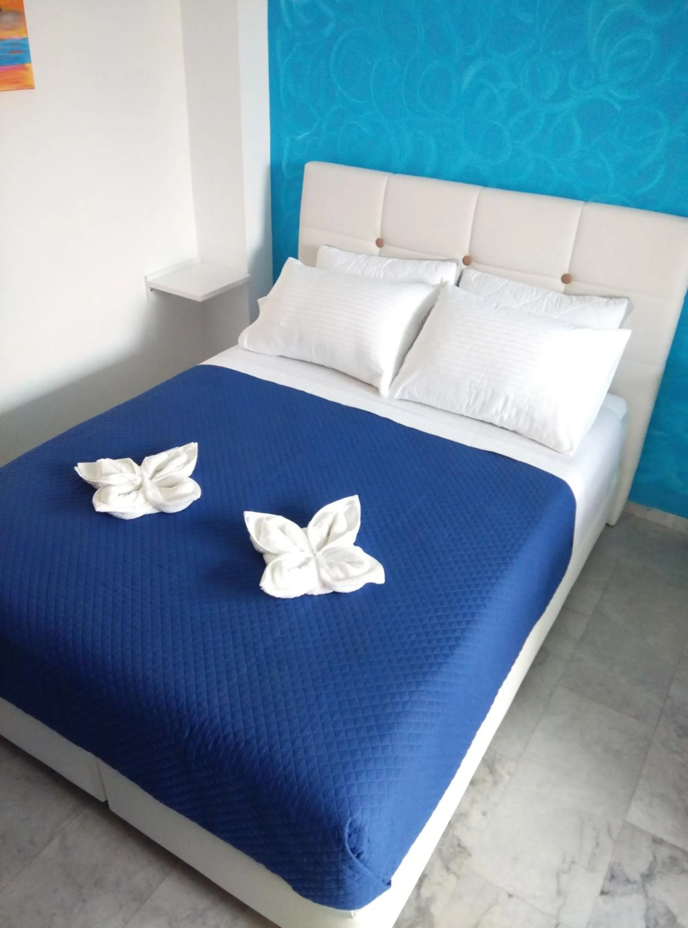 Bed in Poseidon Apartments