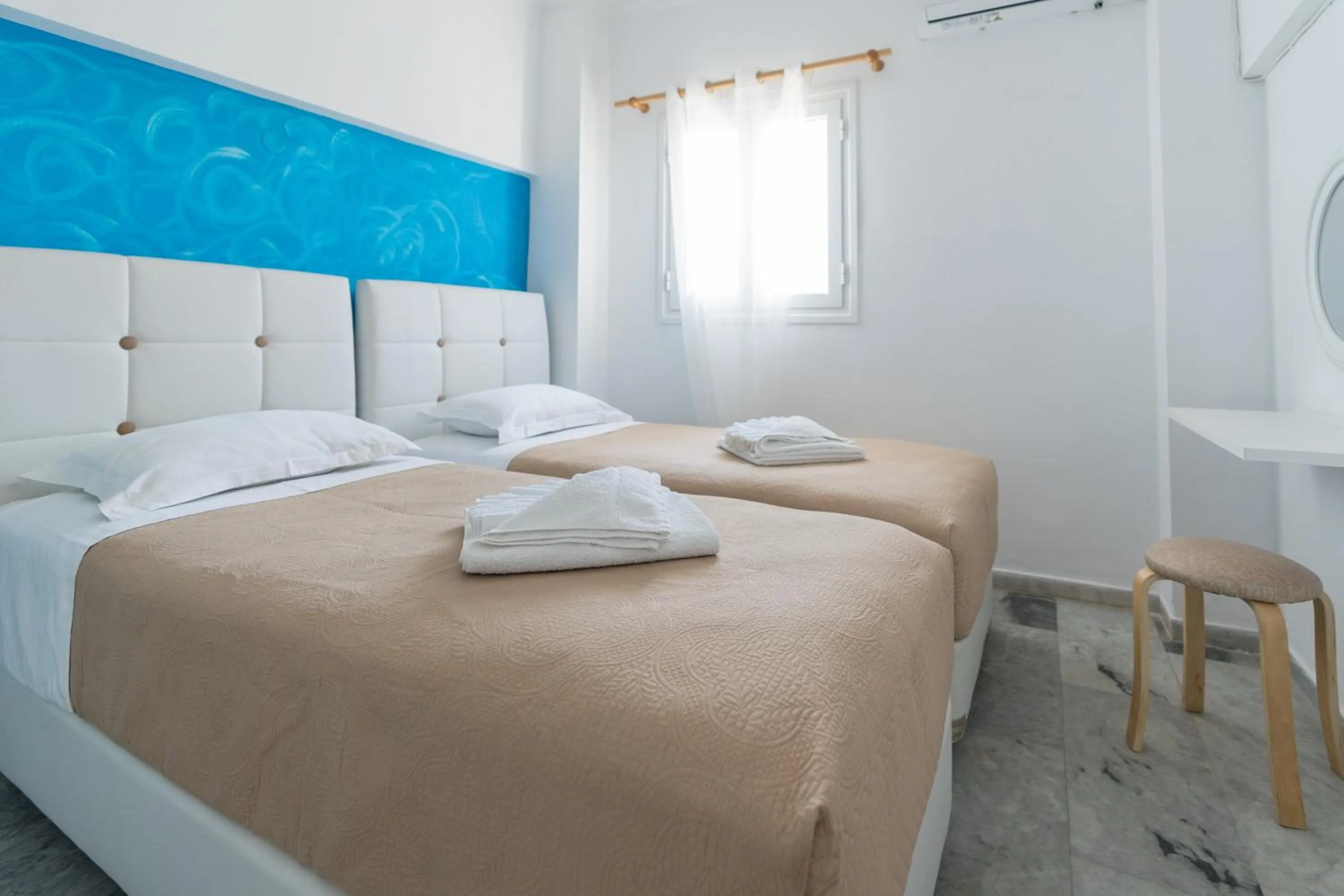 Bed in Poseidon Apartments