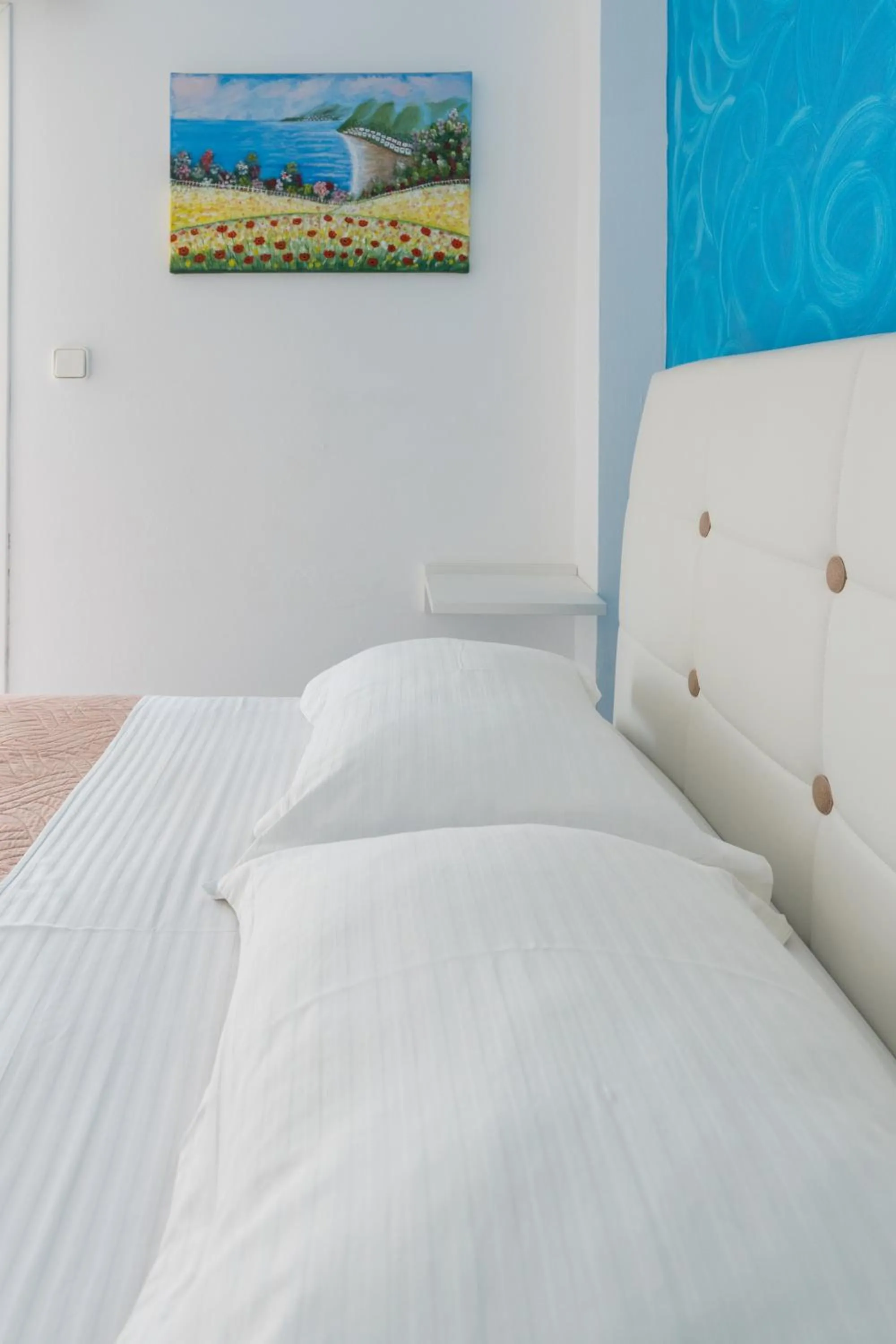 Bed in Poseidon Apartments