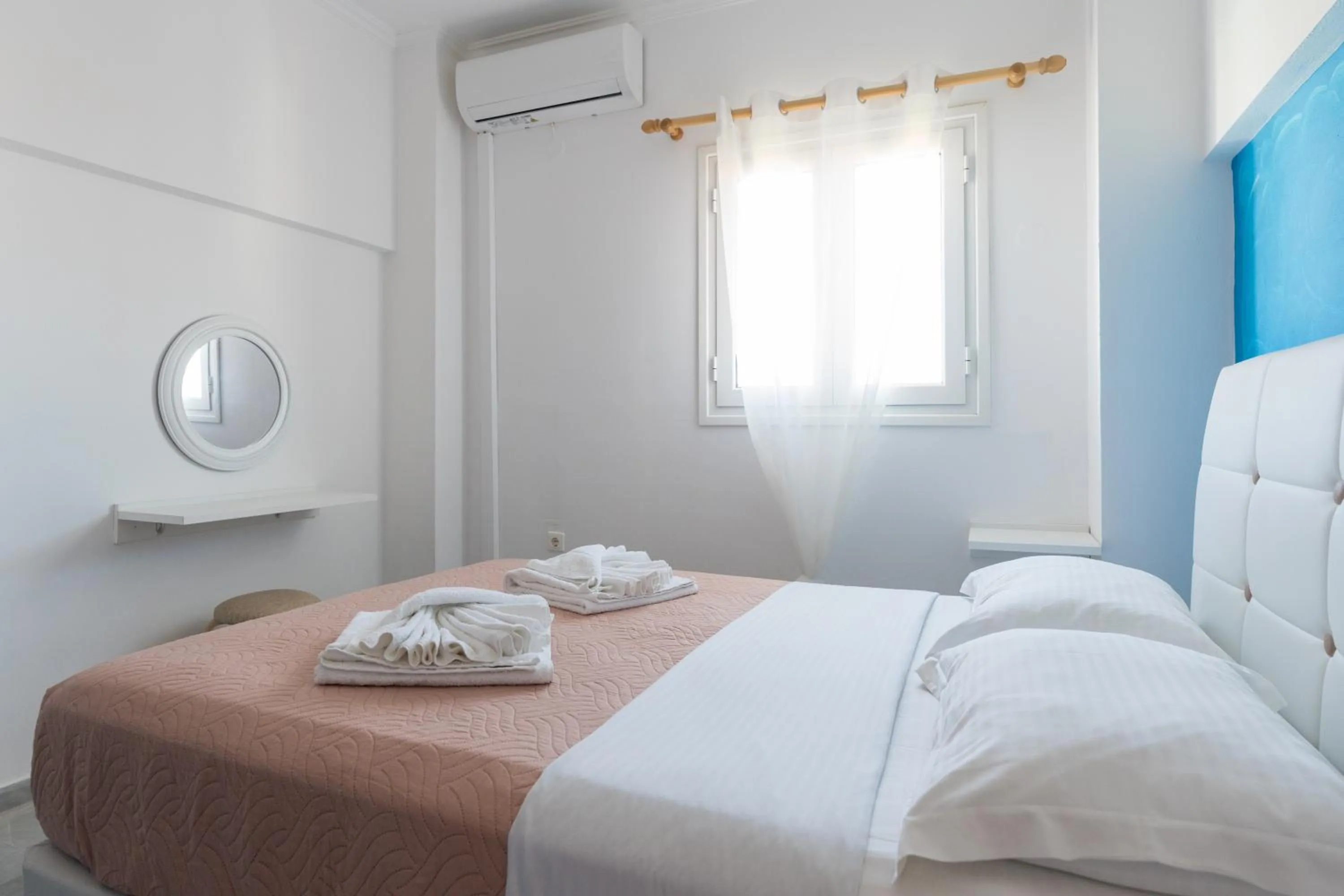 Bed in Poseidon Apartments