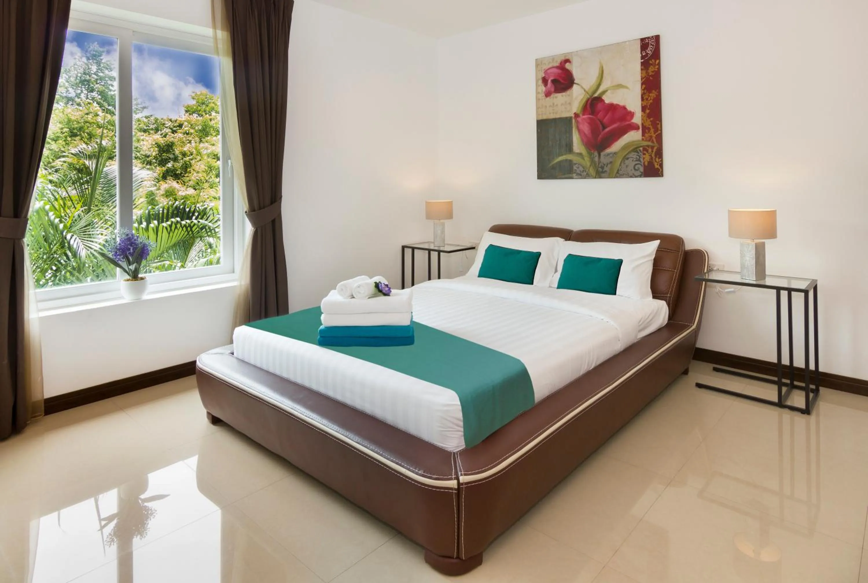 Bed in Tropicana Pool Villa