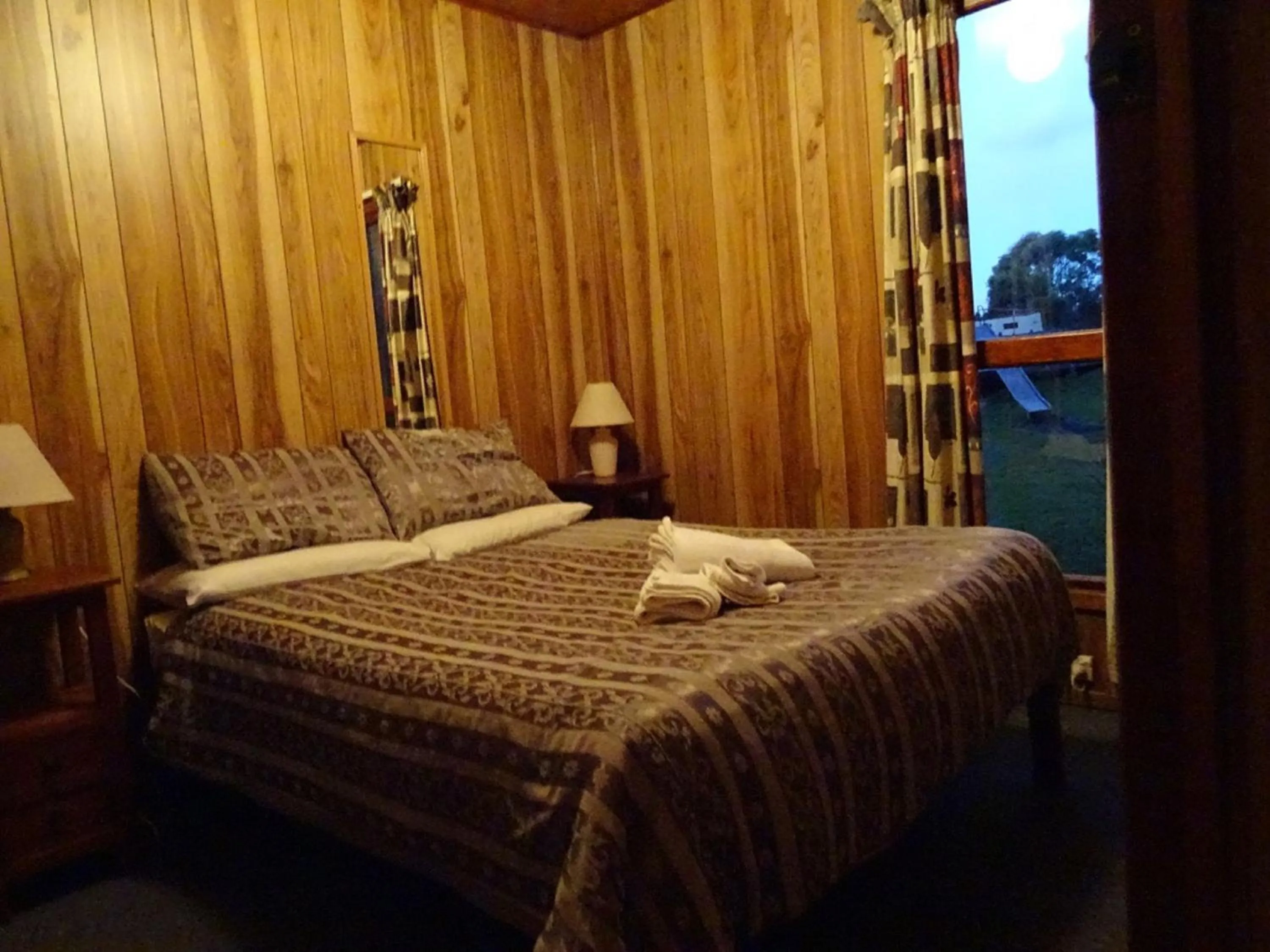 Bed in Crayfish Creek Van & Cabin Park