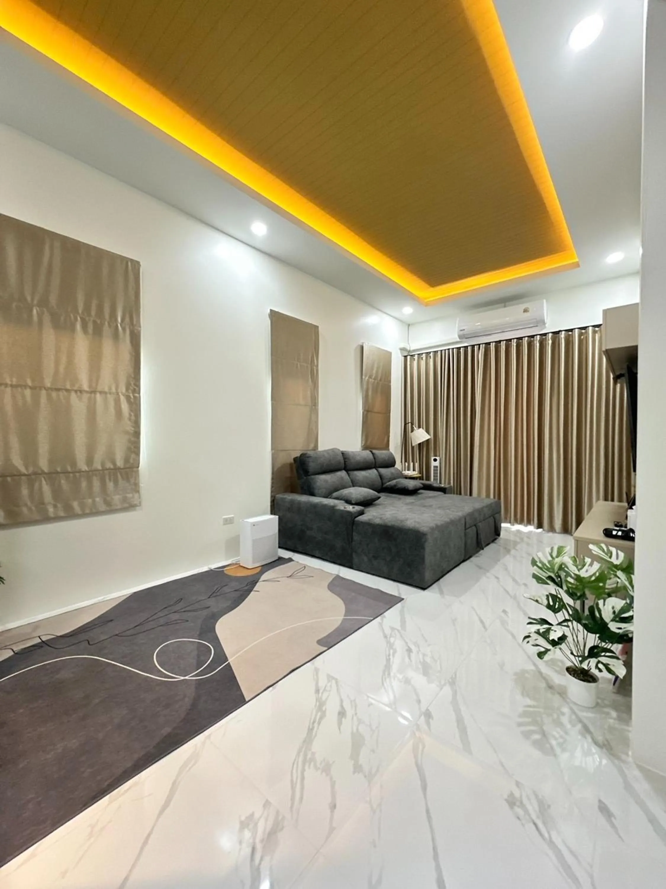 Seating area, Bed in Golden Palm Resort