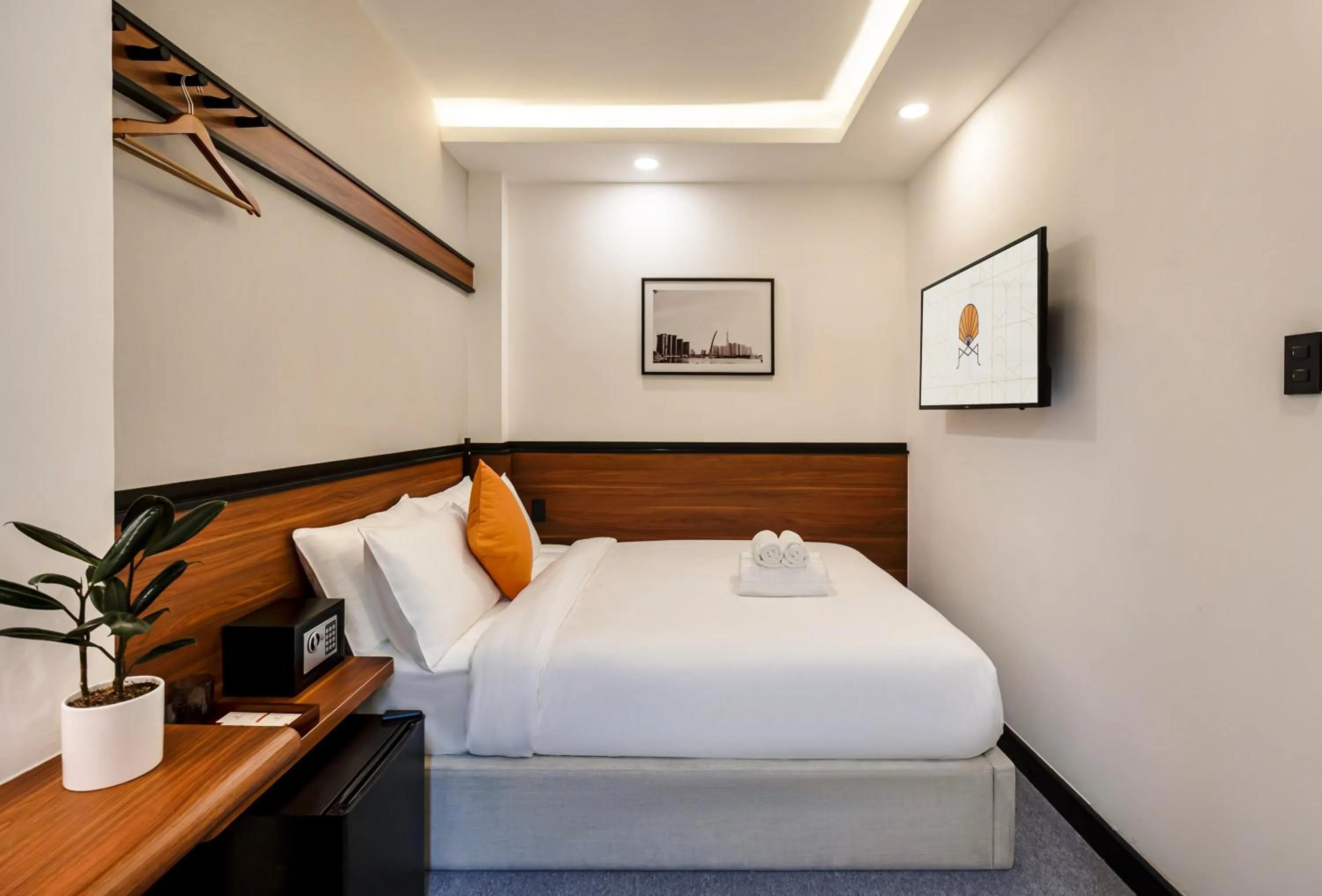 Photo of the whole room, Bed in Metrolux City Contemporary Hotel