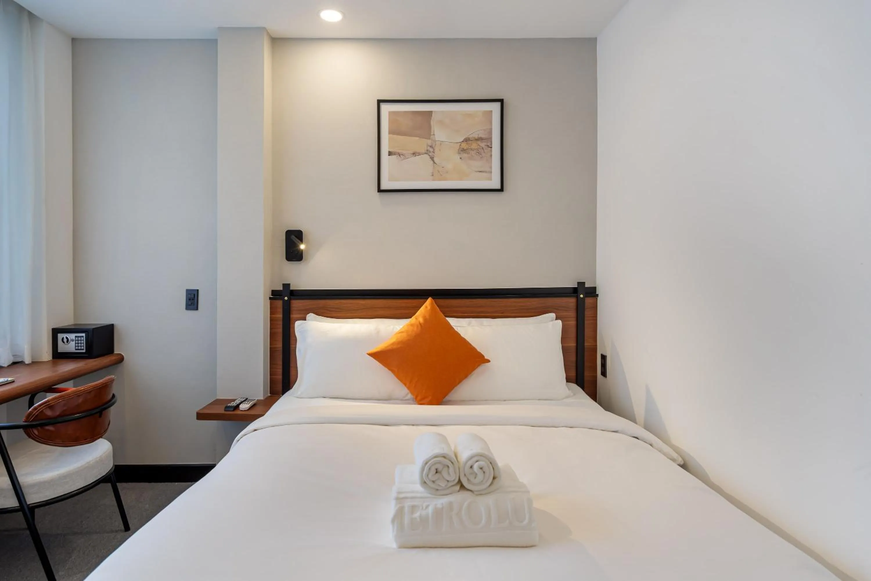 Bed in Metrolux City Contemporary Hotel