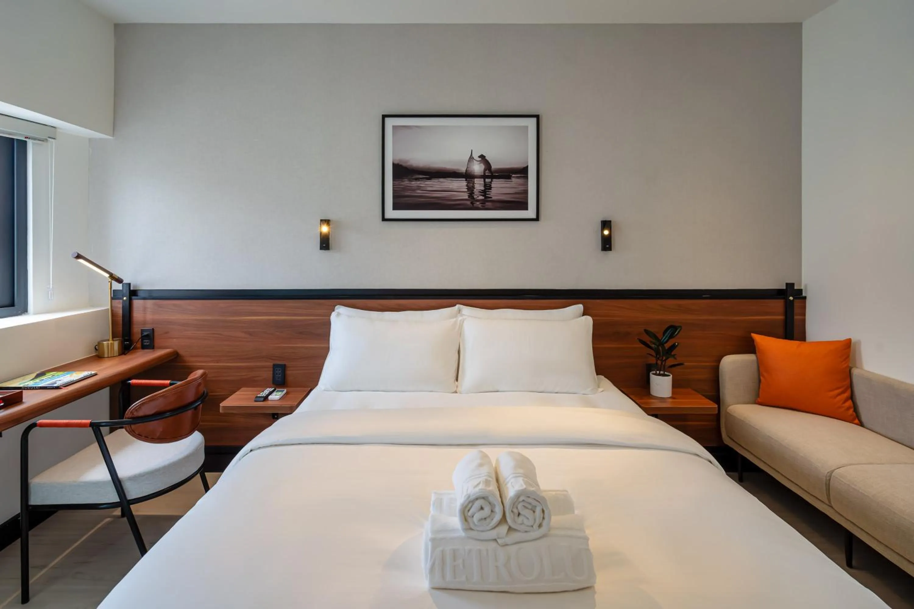 Bed in Metrolux City Contemporary Hotel