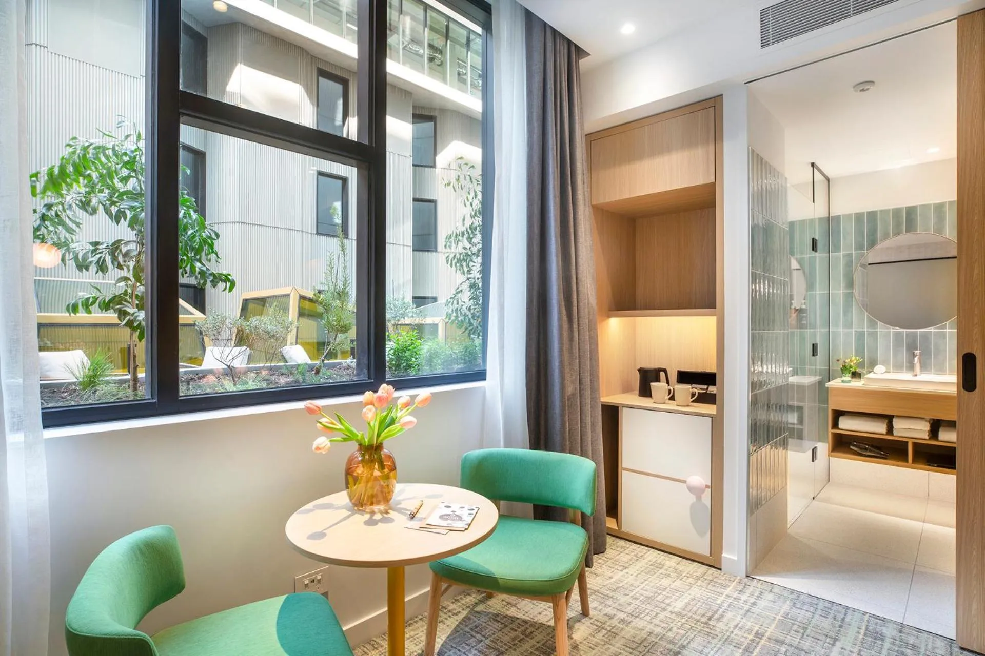 Seating area in Holiday Inn Melbourne Bourke Street Mall by IHG