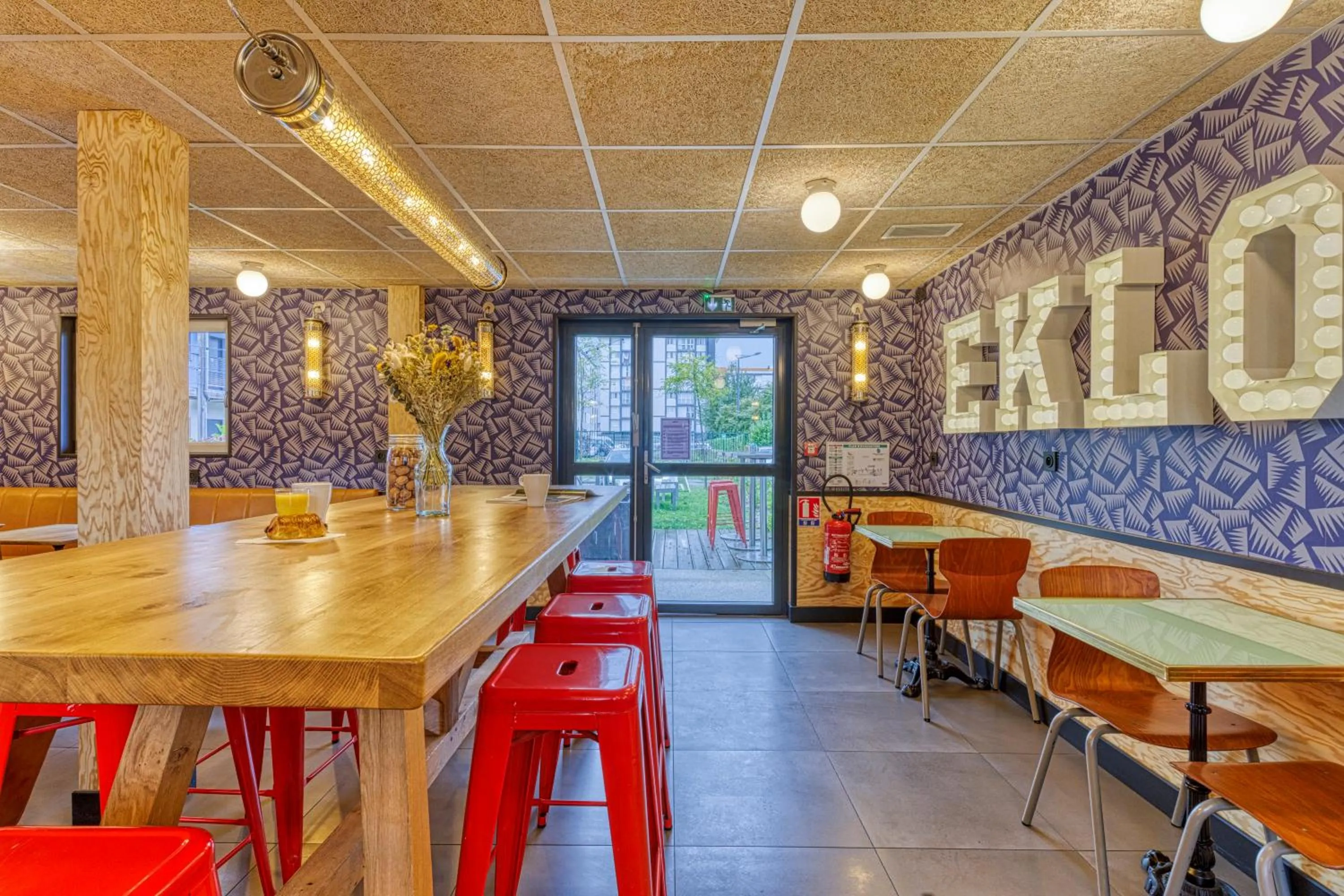 Communal lounge/ TV room in Eklo Hotels Le Havre