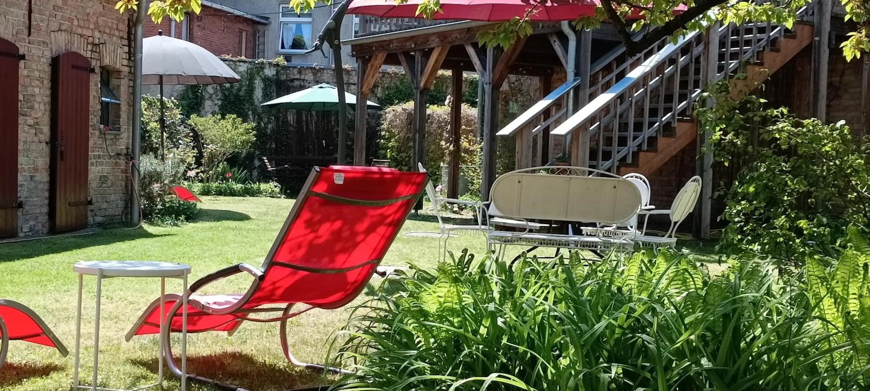 Garden in SchlossparkFerienwohnungen Rheinsberg mit Garten