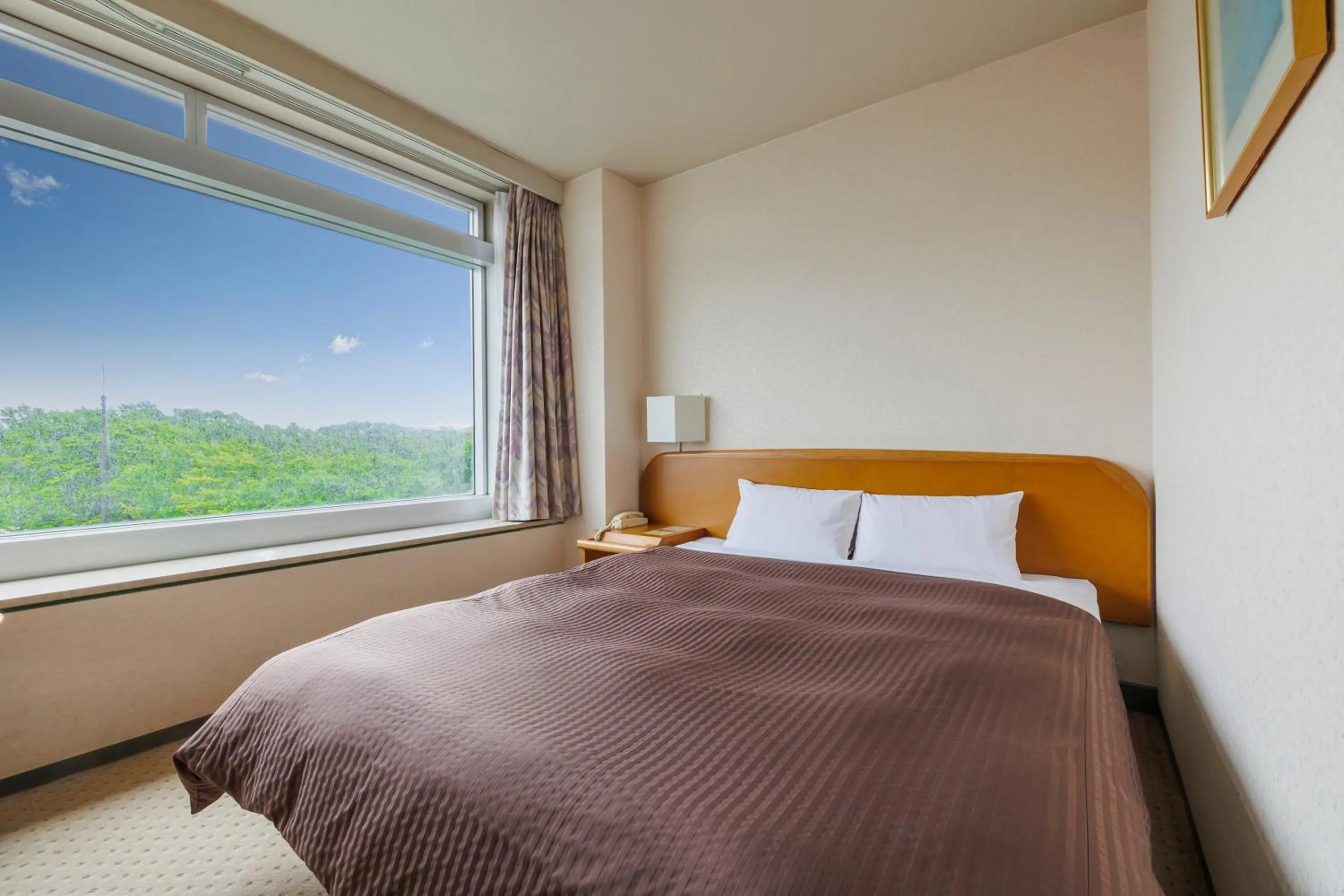 Bed in Kitahiroshima Classe Hotel