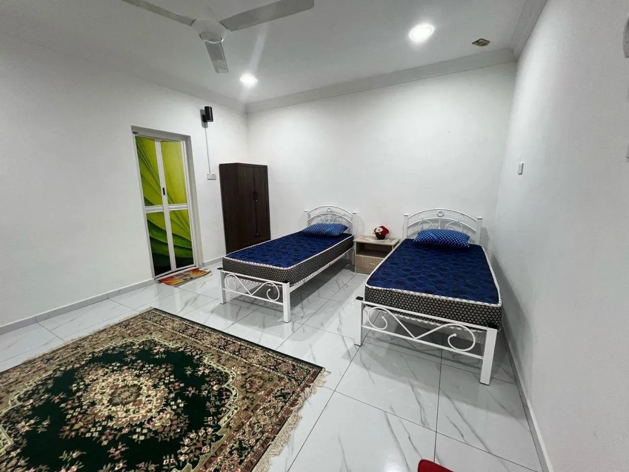 Bedroom in Capital O 91117 Noor Room Stay