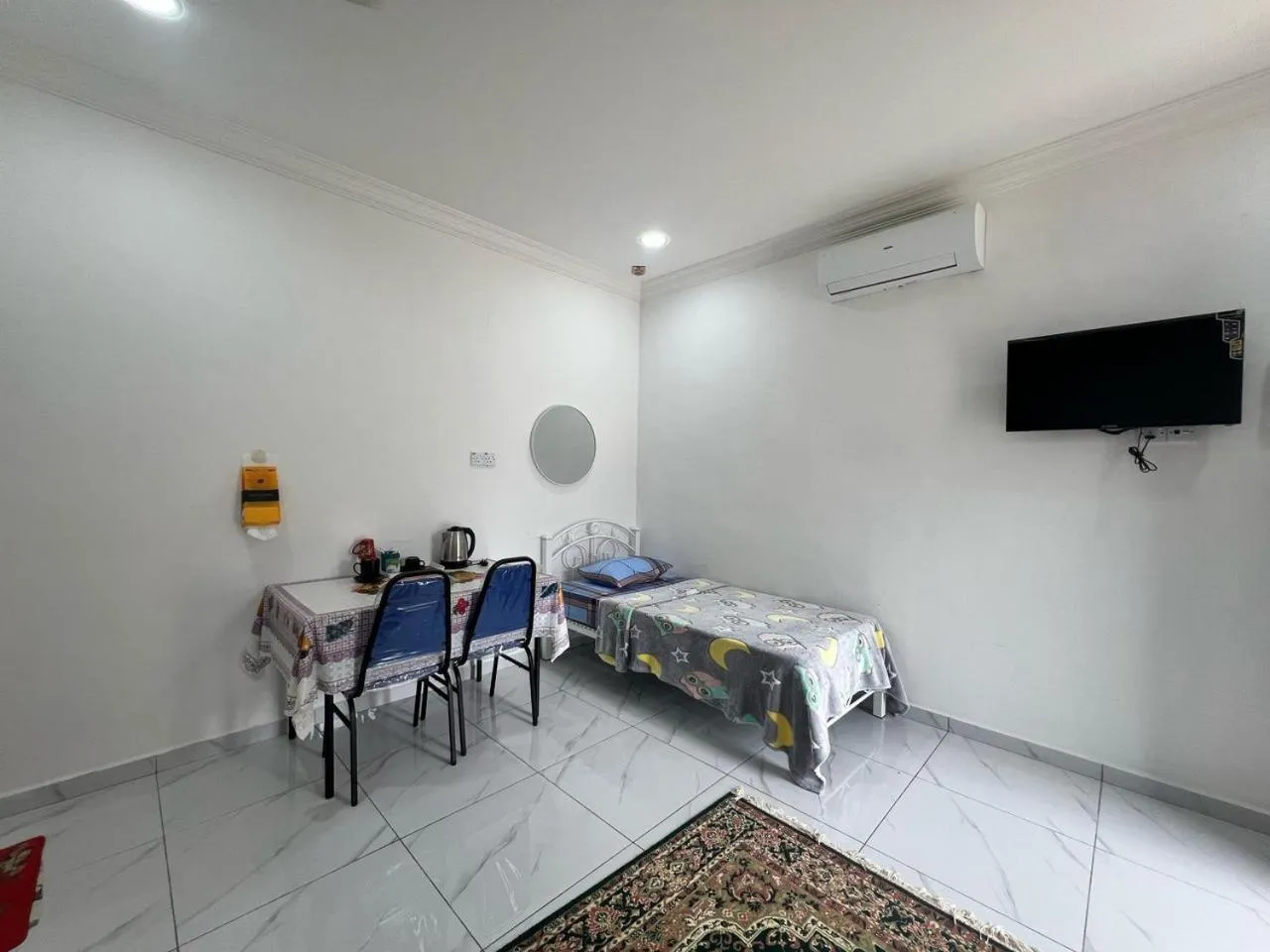 Bedroom in Capital O 91117 Noor Room Stay