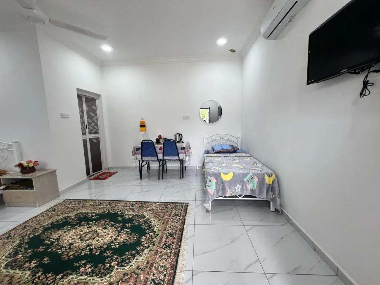 Bedroom in Capital O 91117 Noor Room Stay