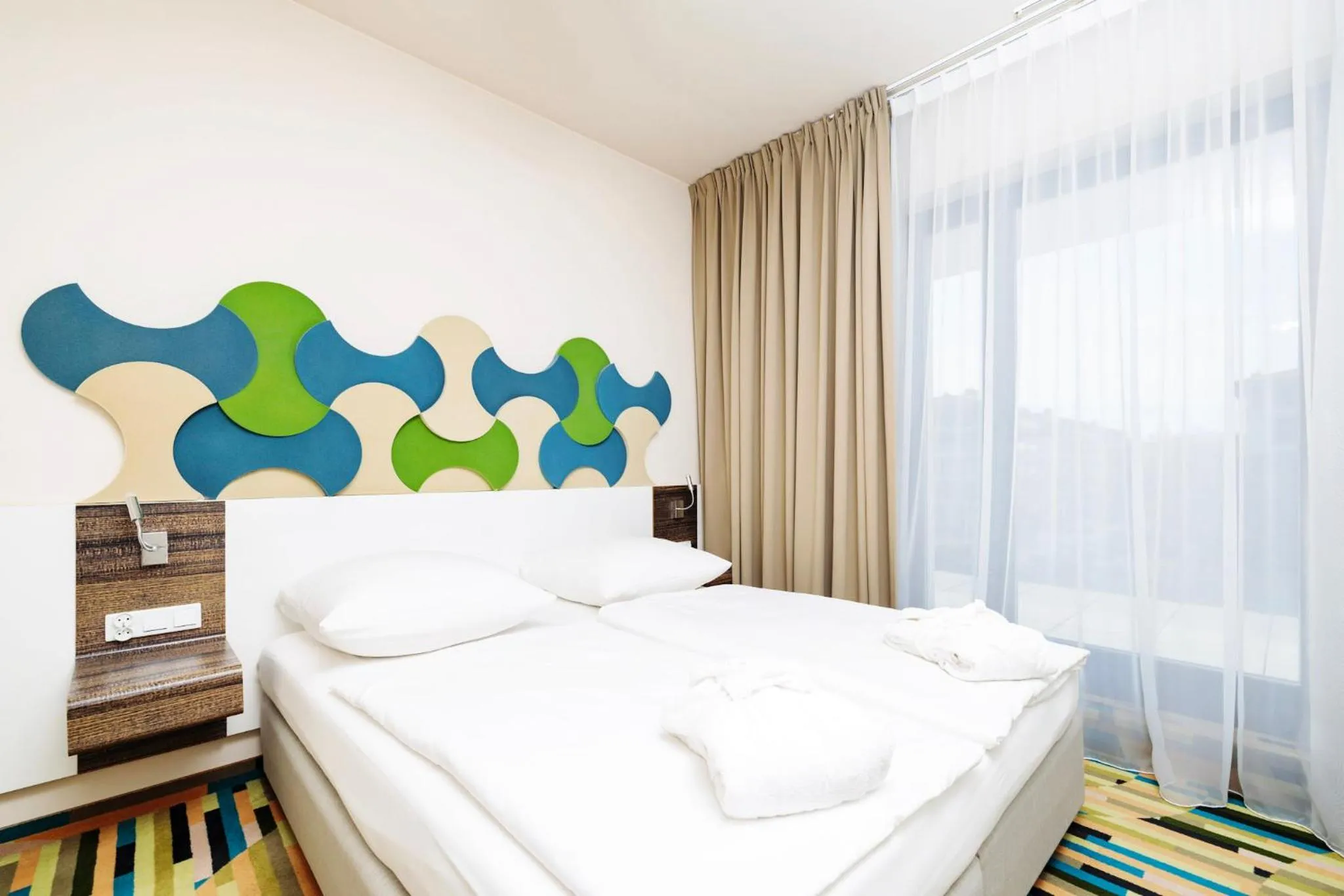 Bed in Baltic Park Molo Apartments by Zdrojowa