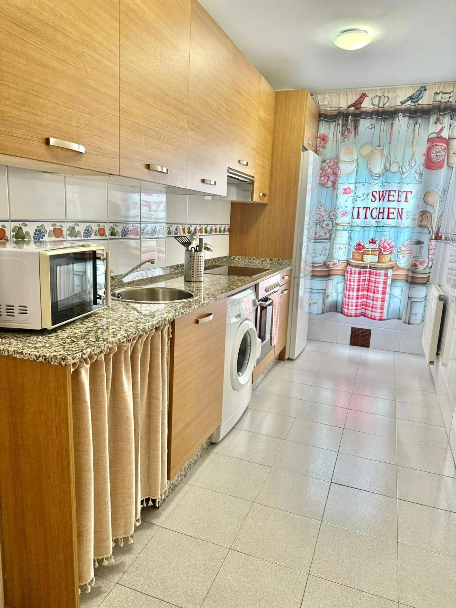 Kitchen or kitchenette in Apartamentos El Caxigu