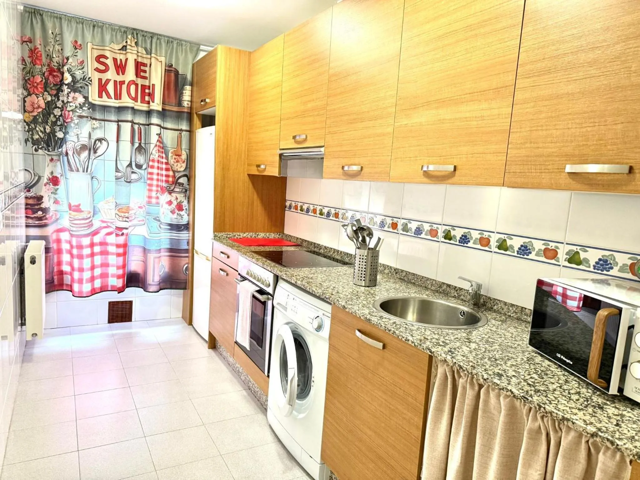 Kitchen or kitchenette in Apartamentos El Caxigu