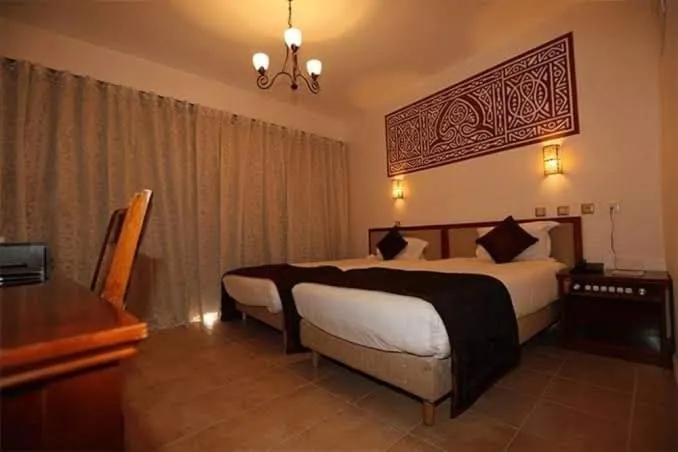Bed in Hotel Gourara