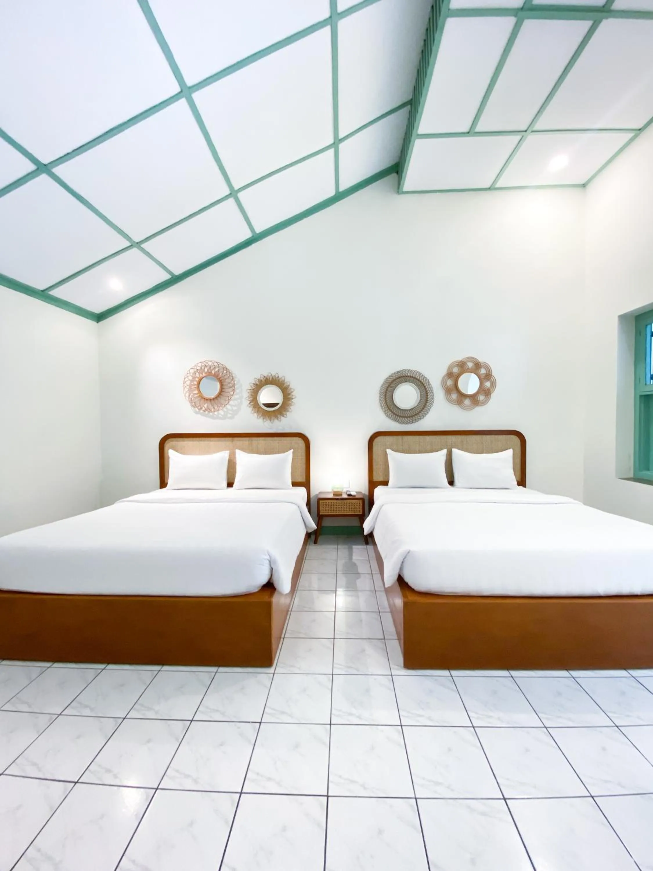 Bed in The Utara Hotel Tugu by Eresha Hospitality