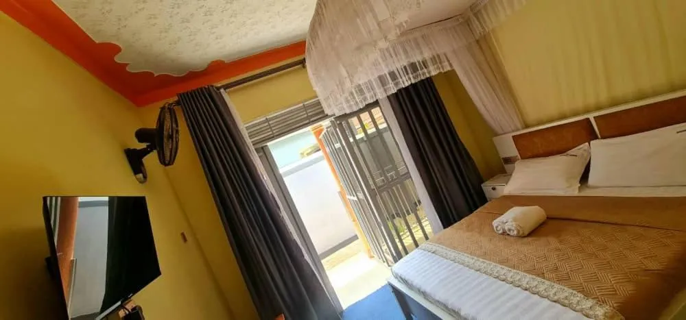 Bed in Meltonia Luxury Inn