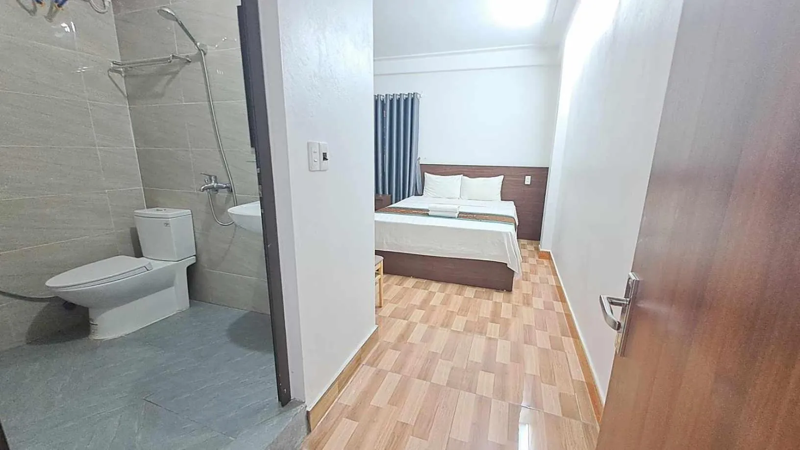 Toilet, Bed in Family Transit Hotel