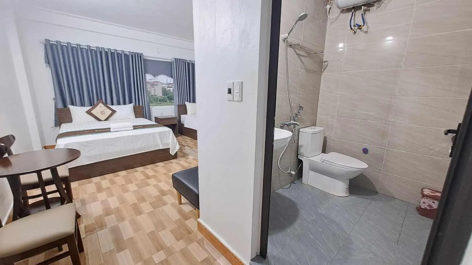 Toilet, Bed in Family Transit Hotel