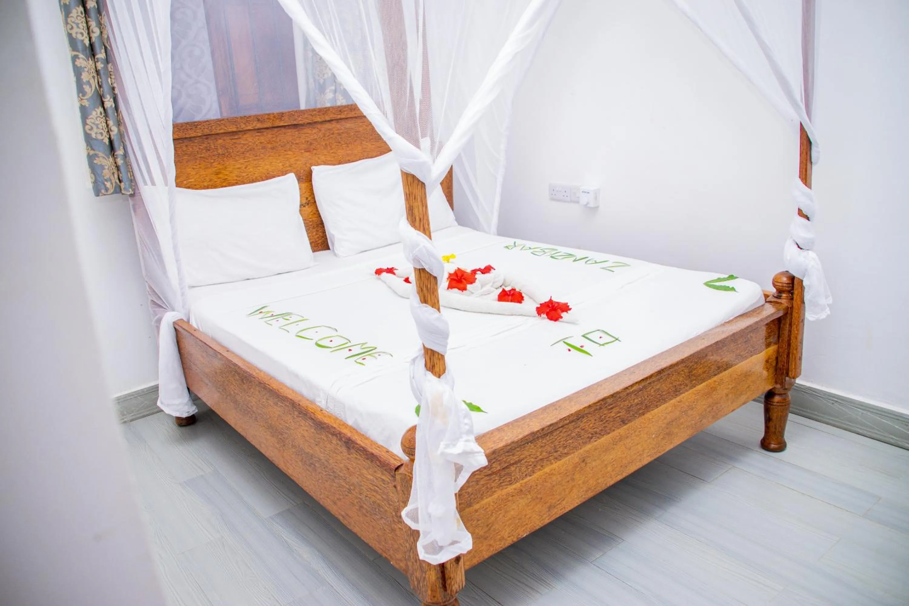 Bed in Amazing Beach Hotel Zanzibar