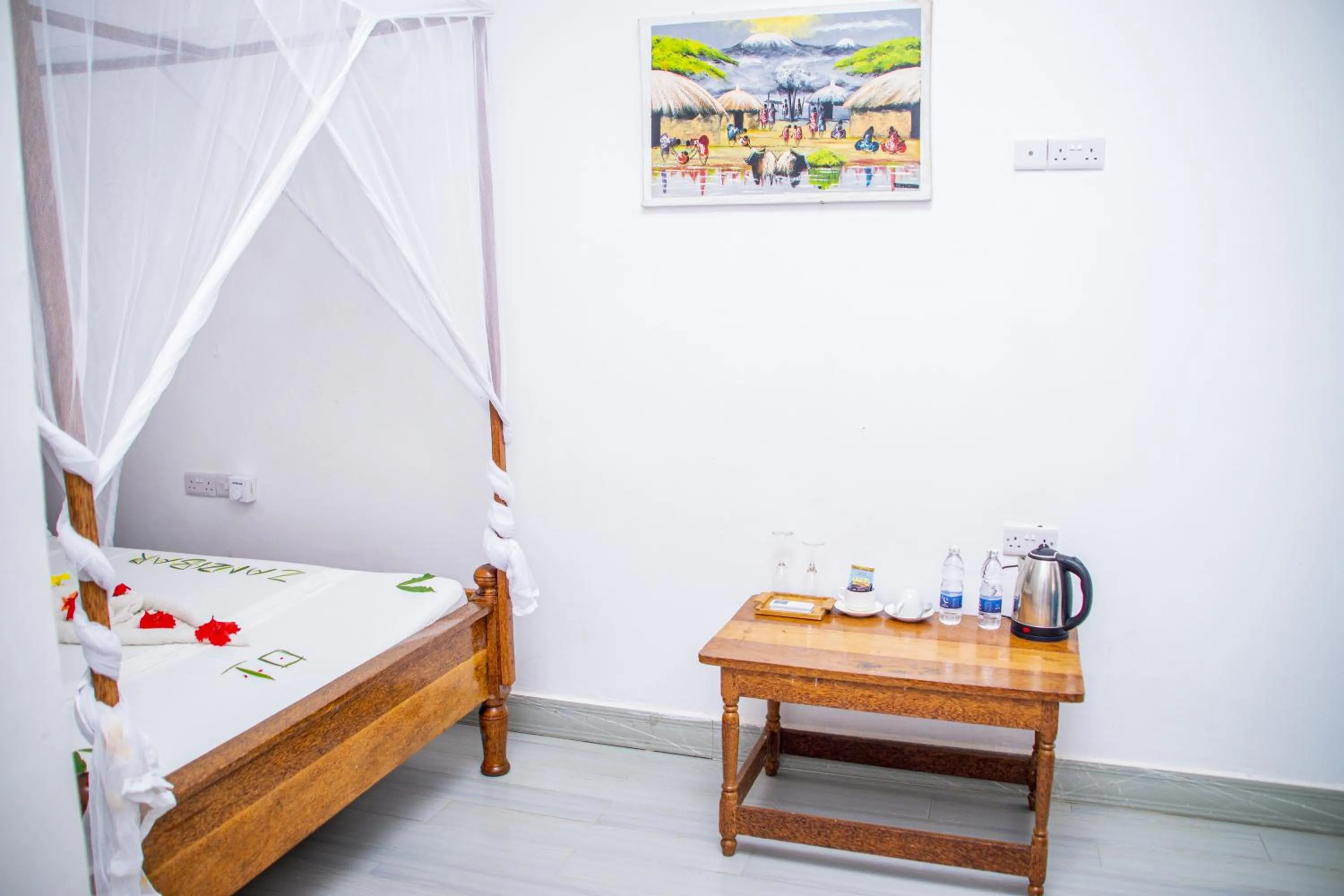 Coffee/tea facilities, Bed in Amazing Beach Hotel Zanzibar