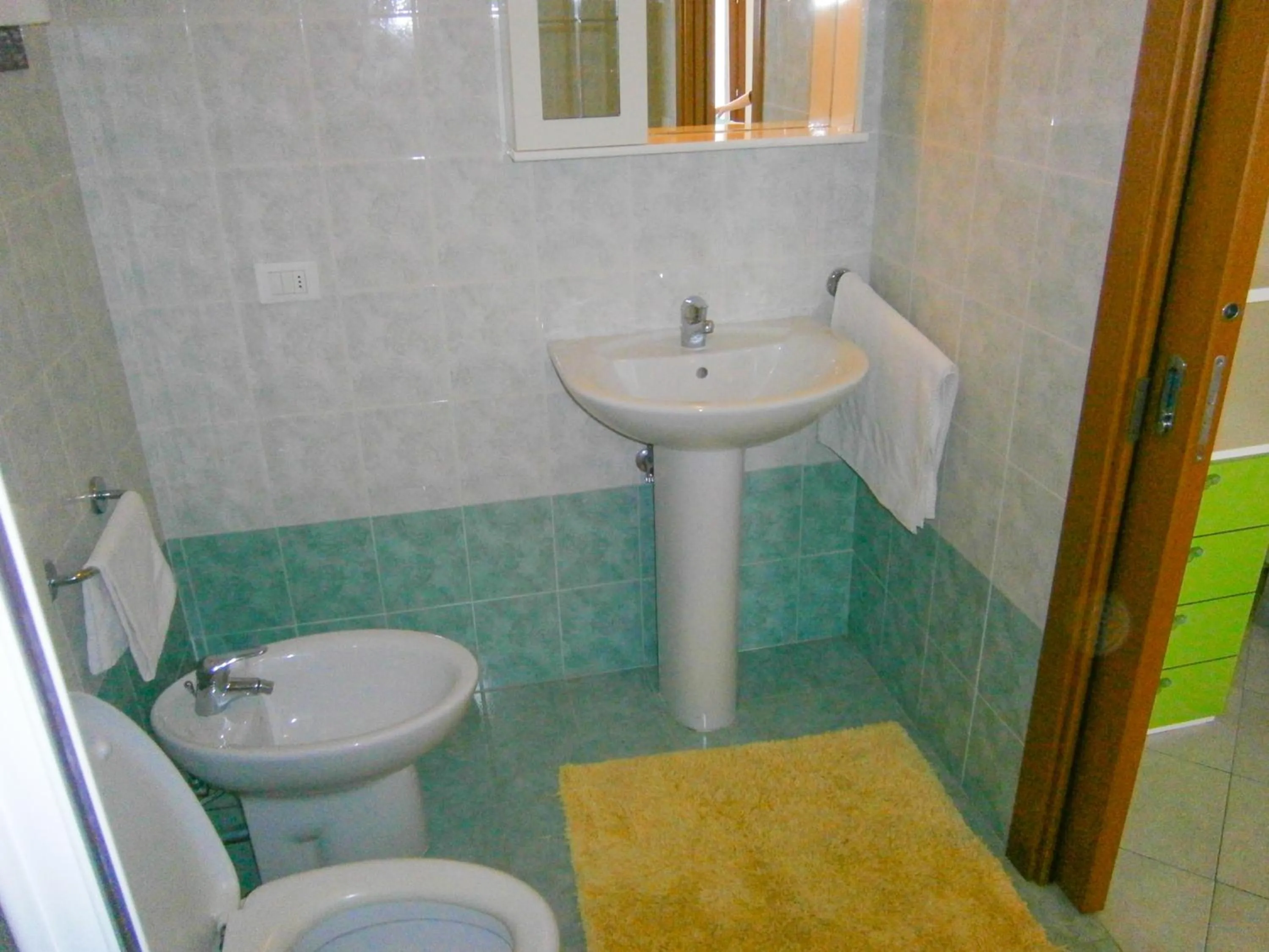 Bathroom in Villaggio dei Fiori - Agenzia Cocal