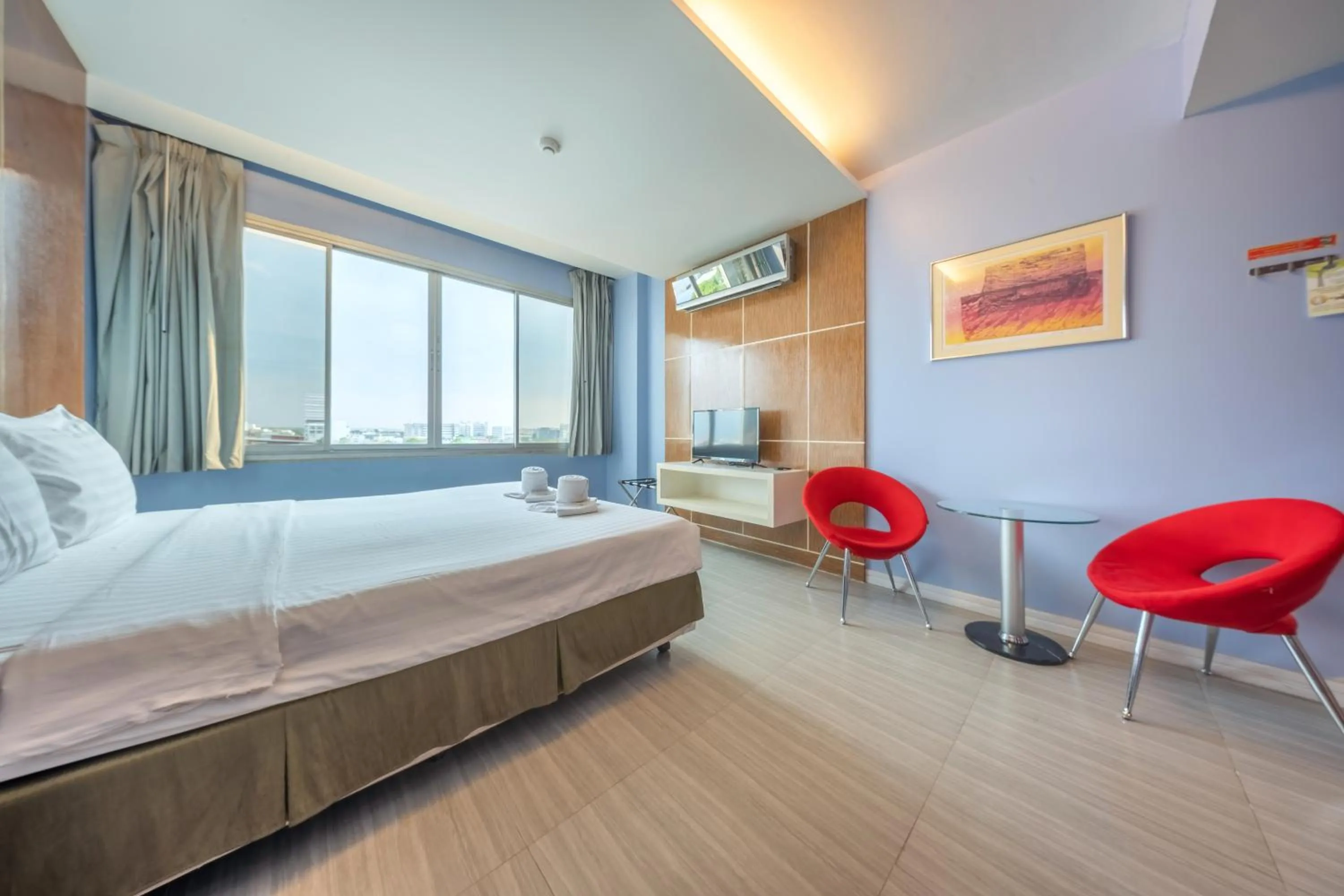 Bed in SHIN Hotel V-ONE Korat