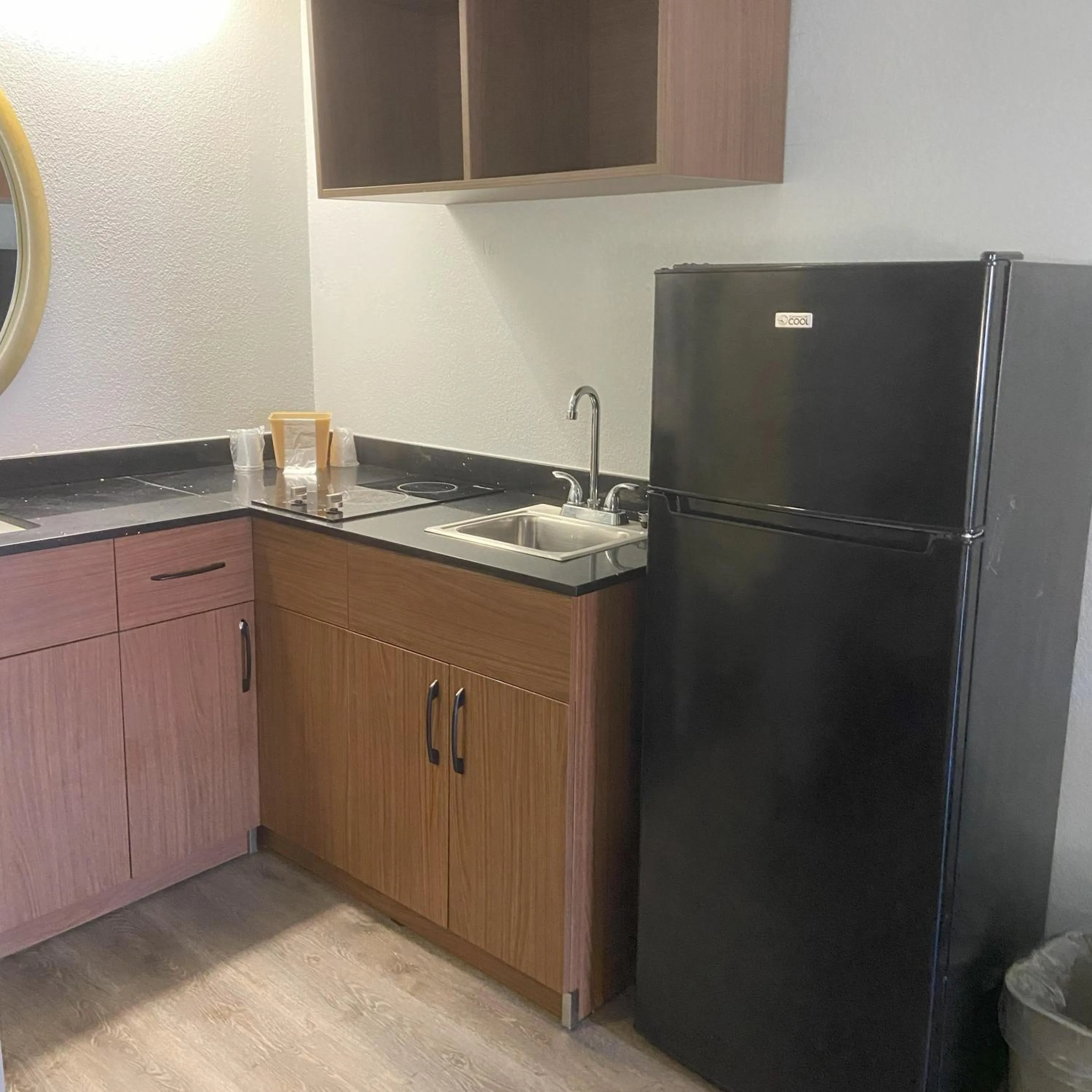 kitchen in HomeTowne Studios by Red Roof Buffalo - Niagara Airport