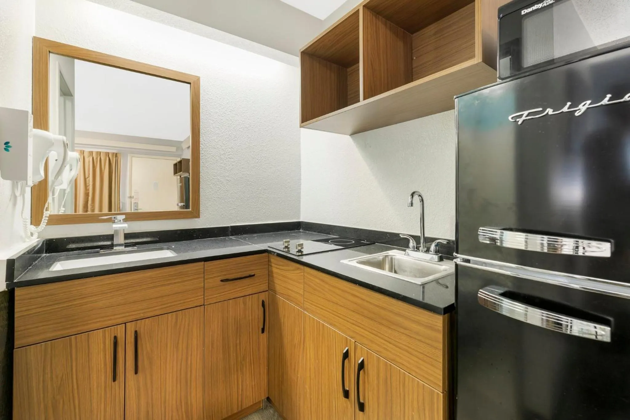 Kitchen or kitchenette in HomeTowne Studios by Red Roof Buffalo - Niagara Airport