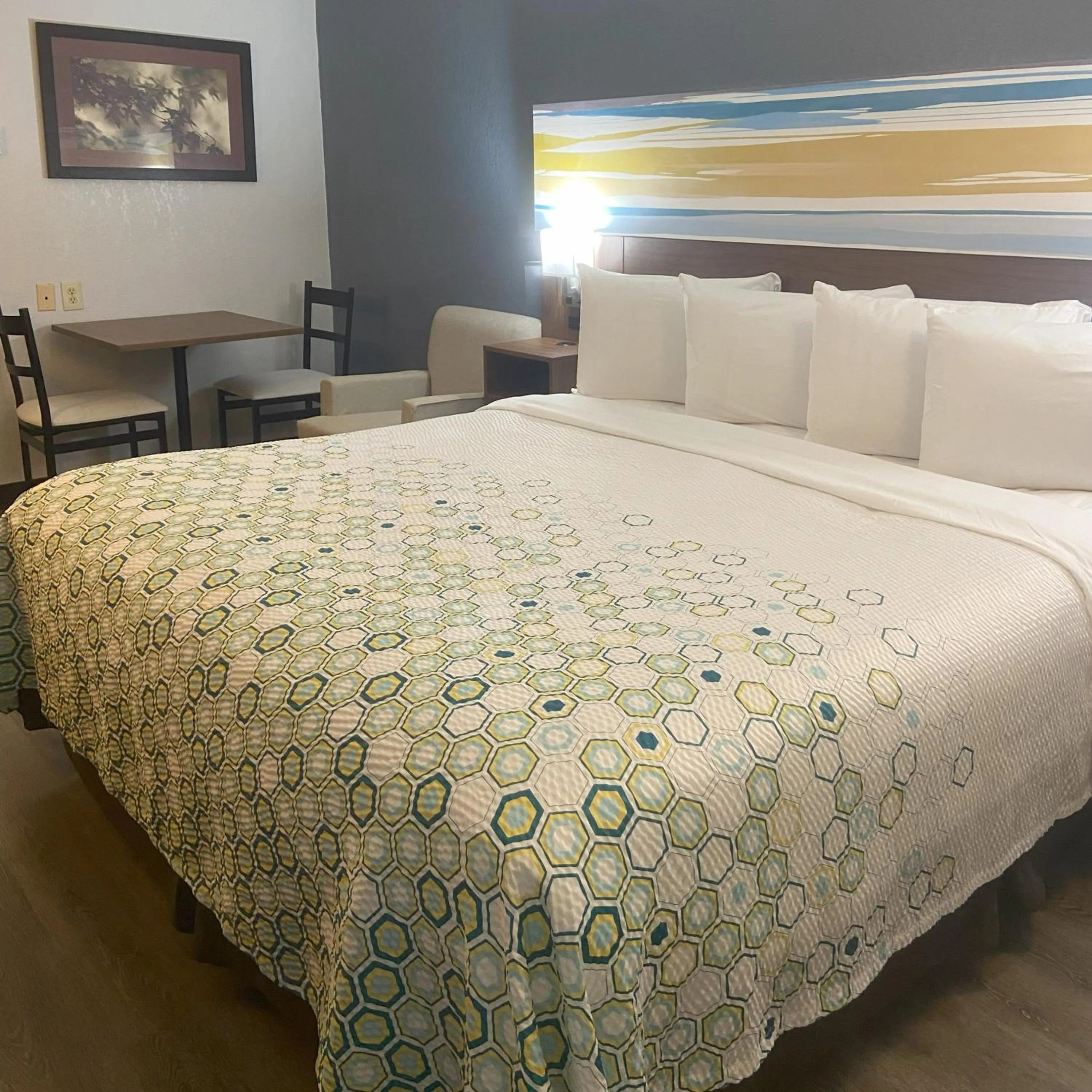 Bedroom, Bed in HomeTowne Studios by Red Roof Buffalo - Niagara Airport