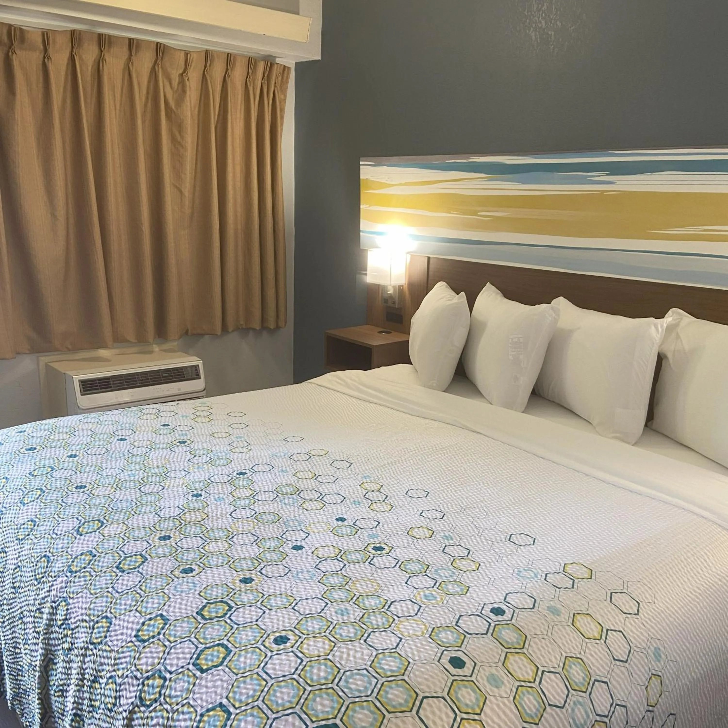 Bedroom, Bed in HomeTowne Studios by Red Roof Buffalo - Niagara Airport