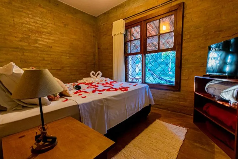 Bed in Pousada Chale Luiz