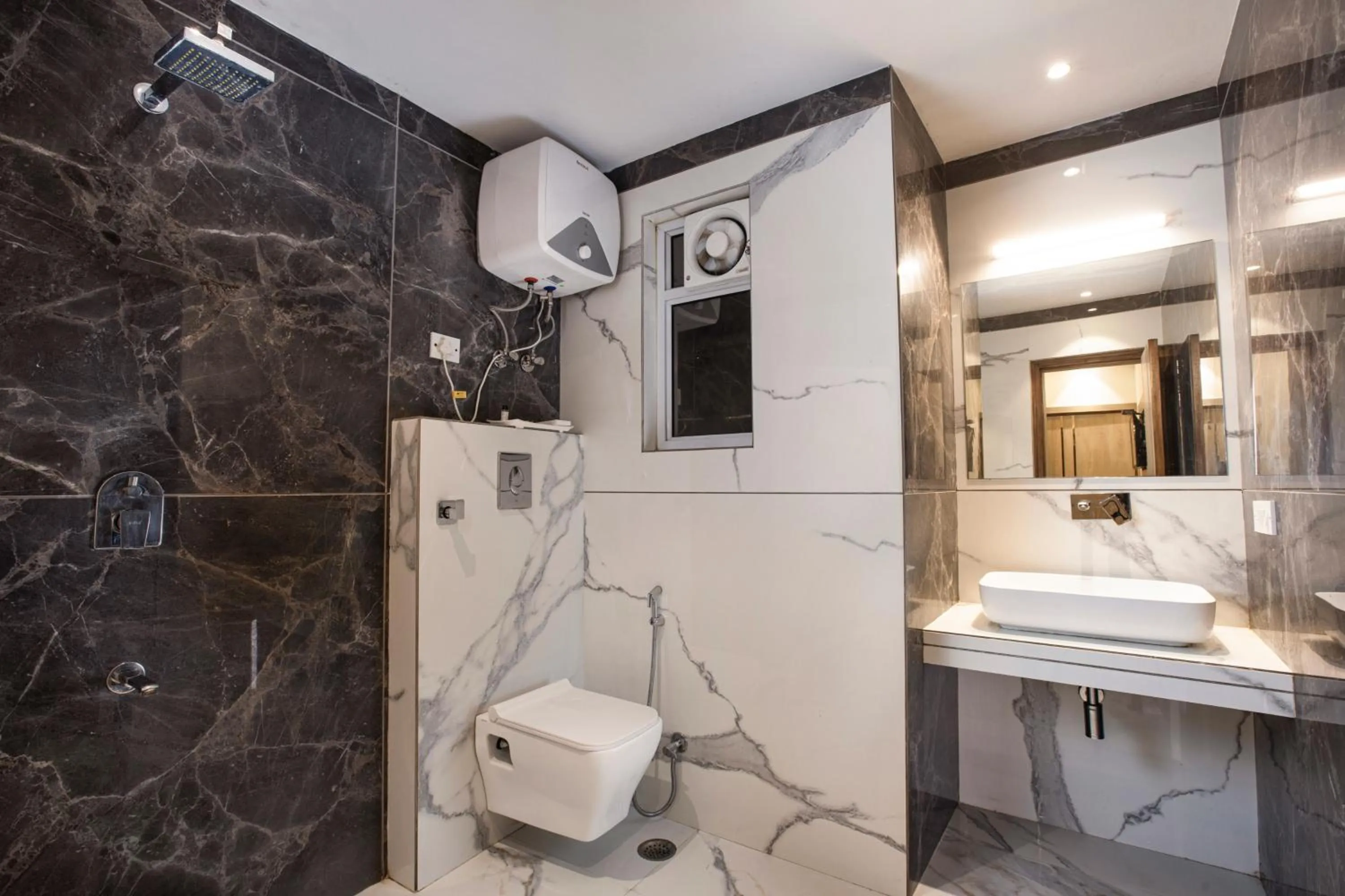 Bathroom in Hotel DELHI 37 by STAR GROUP