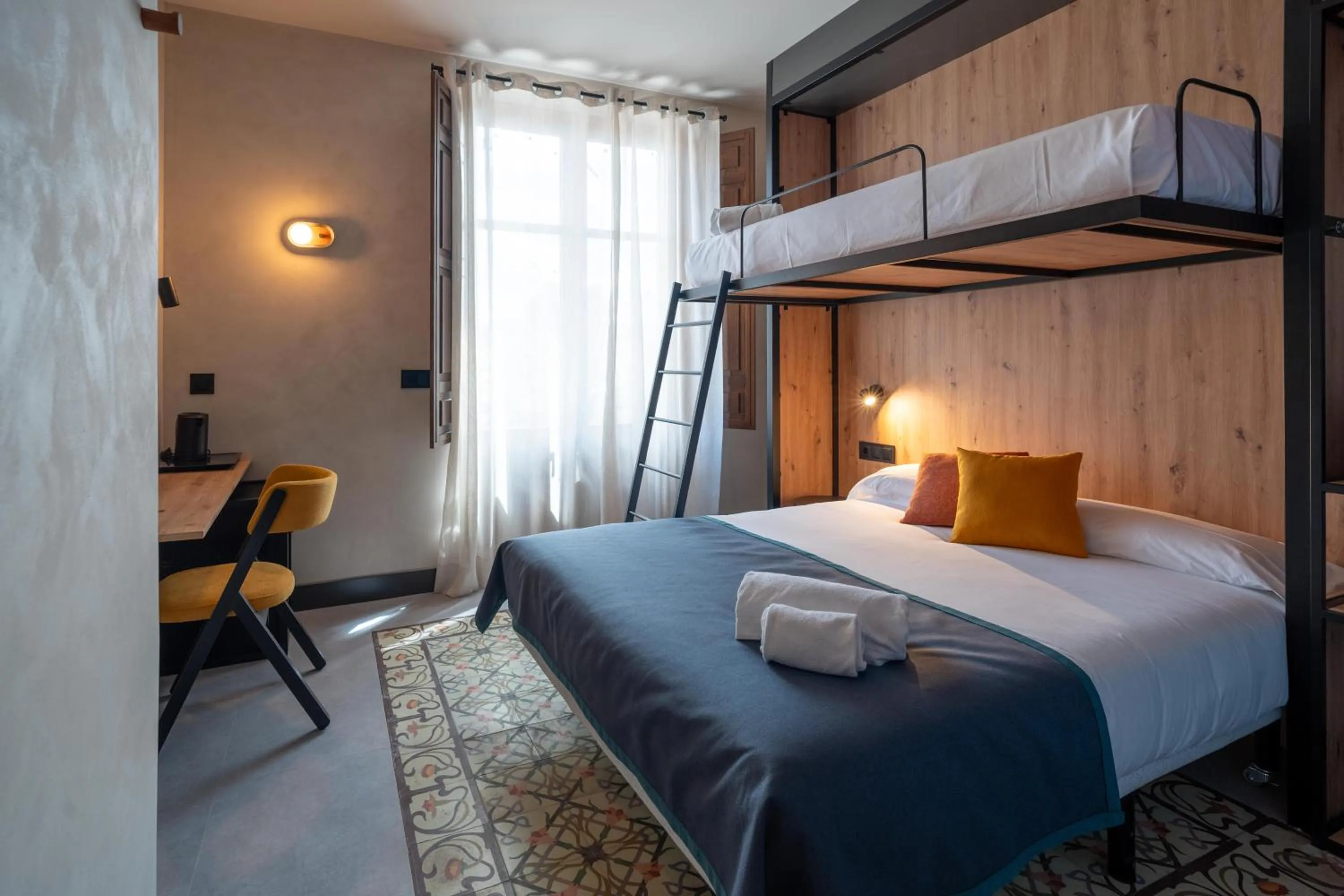 Bed in The Central House Granada Elvira