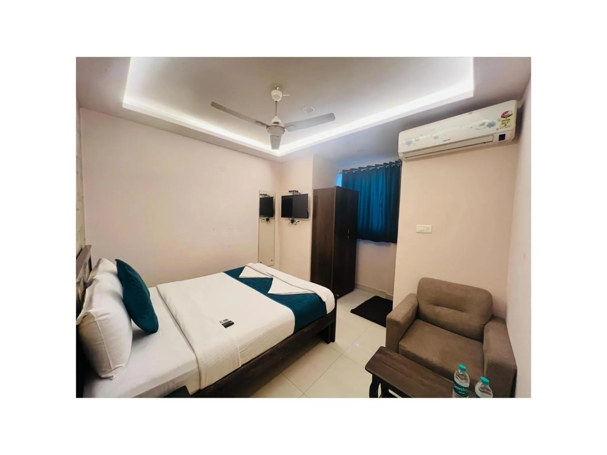 Seating area, Bed in Blue Bliss Suites By PPH Living