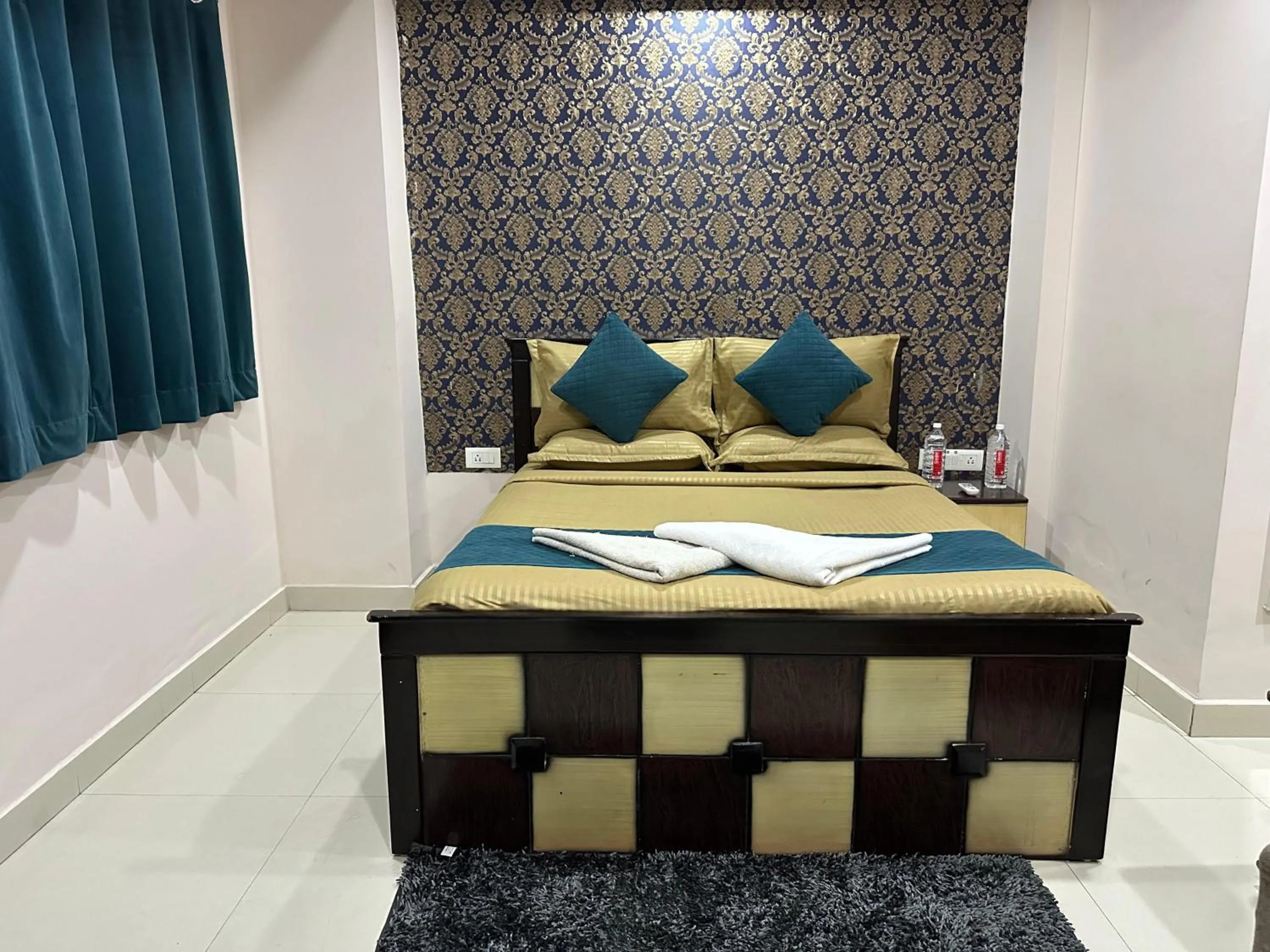 Bed in Blue Bliss Suites By PPH Living