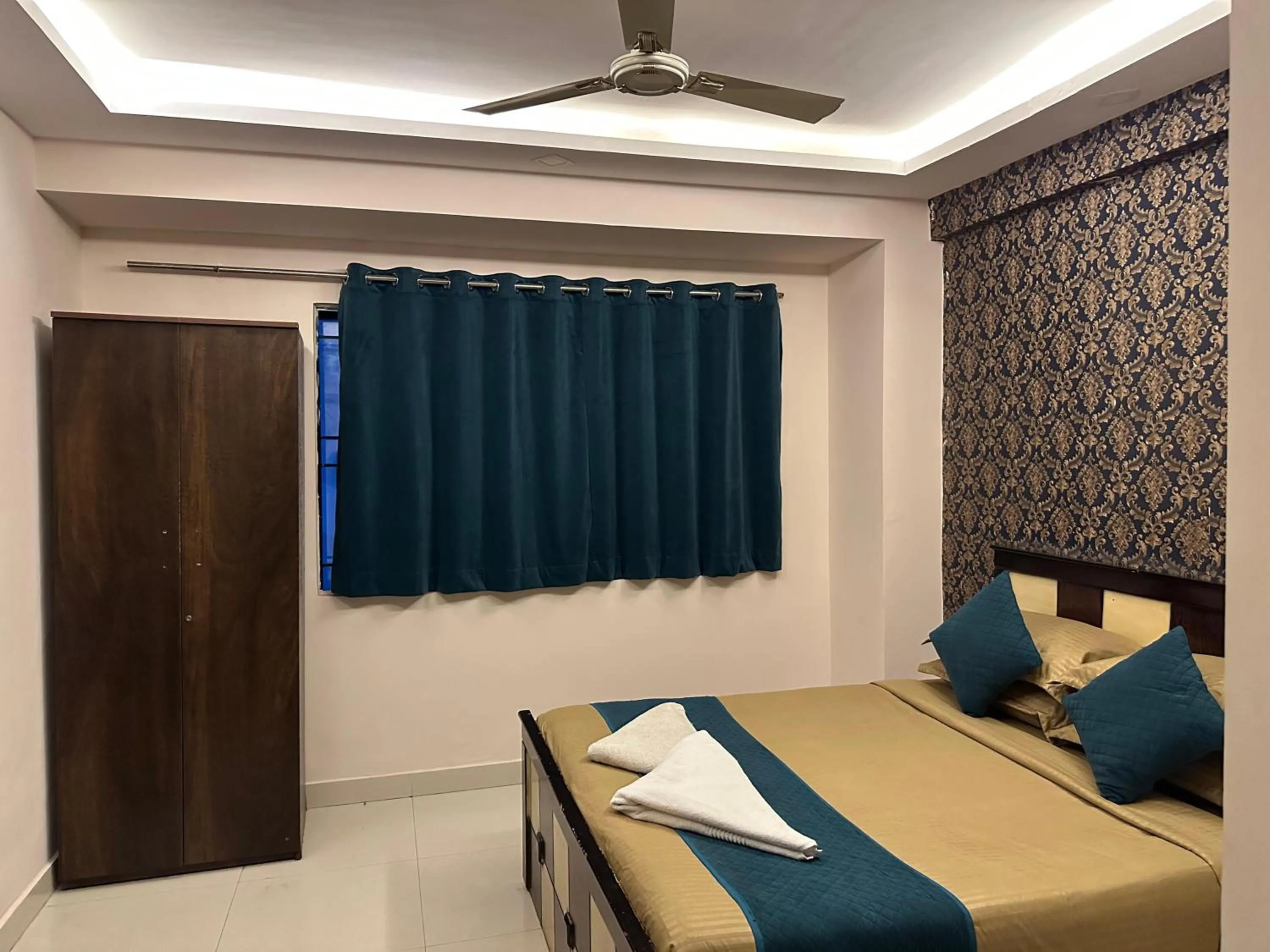 Bed in Blue Bliss Suites By PPH Living