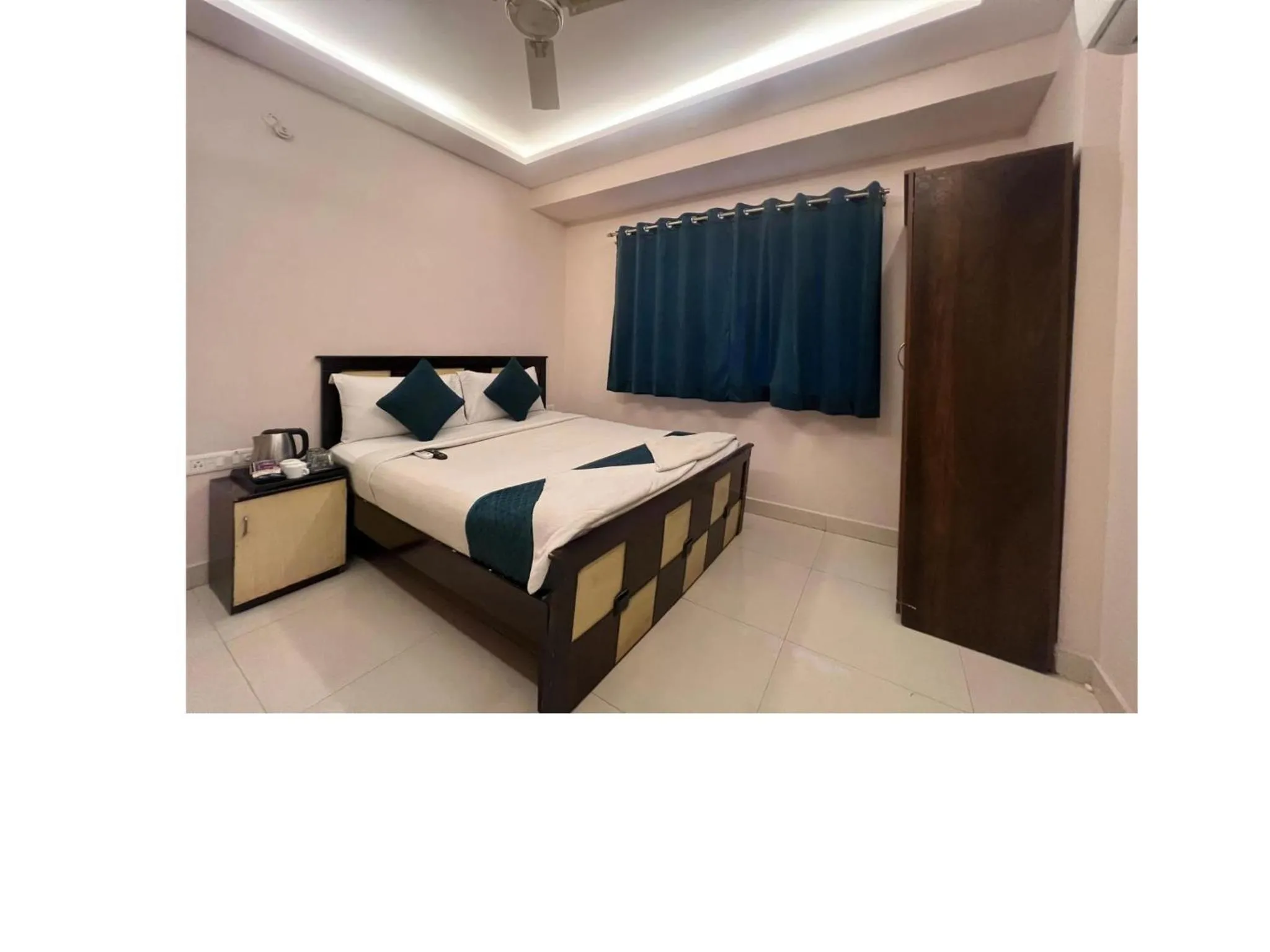 Bed in Blue Bliss Suites By PPH Living